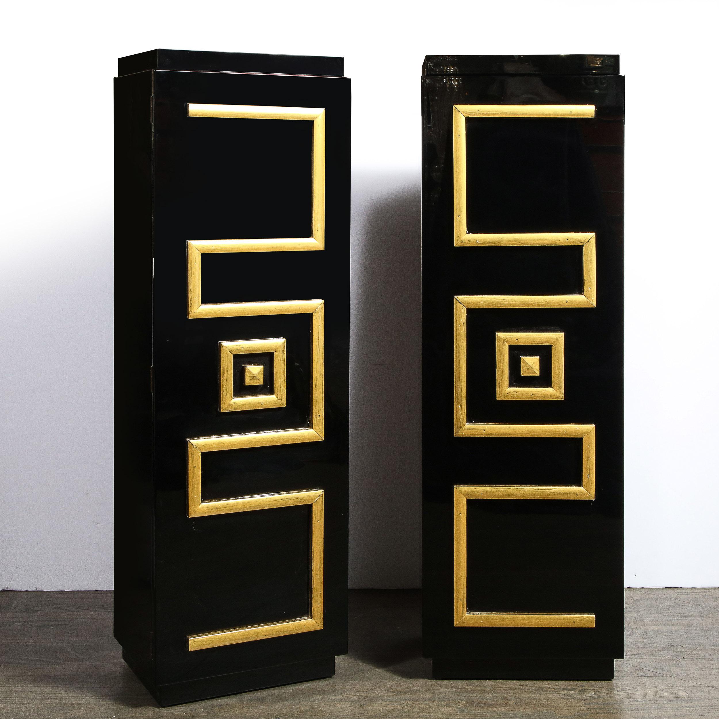This stunning pair of custom pedestal cabinets were realized by the legendary 20th century designer James Mont in the United States circa 1950. They feature volumetric rectangular bodies in lustrous black lacquer with a stylized greek key form in