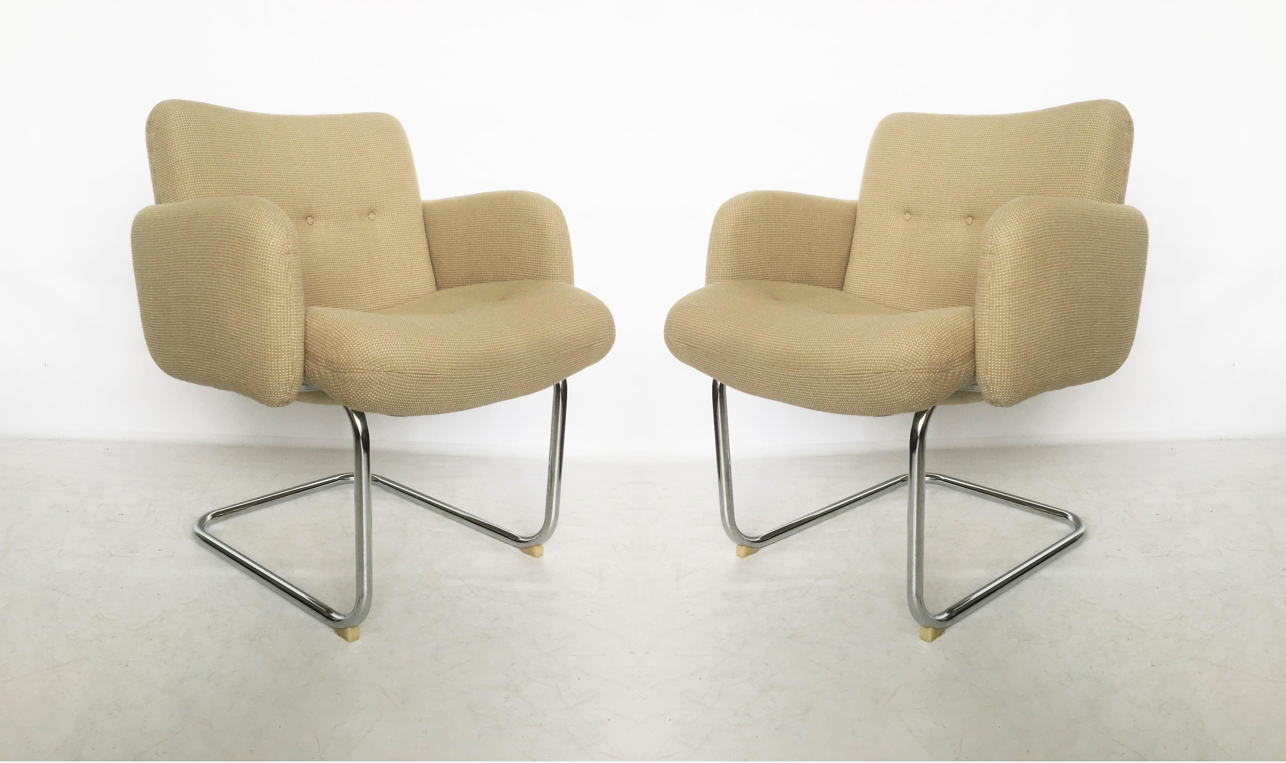 Adorable pair of Harvey Probber occasional lounge chairs. Very comfortable chairs with chrome cantilevered frames upholstered in their original light tan color fabric. Can be used as occasional chairs, game or desk chairs. One chairs retains