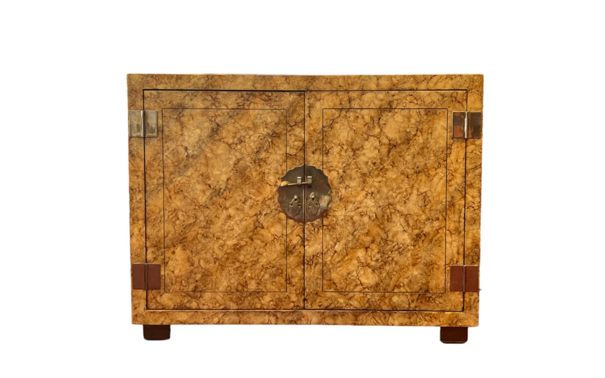 A pair of Mid-Century Modern contemporary Asian-inspired Tortoise Cabinets by Henredon. 

Each cabinet features a faux tortoise finish, hand-painted to perfection, ensuring that no two are alike. This distinctive finish showcases the beauty of a