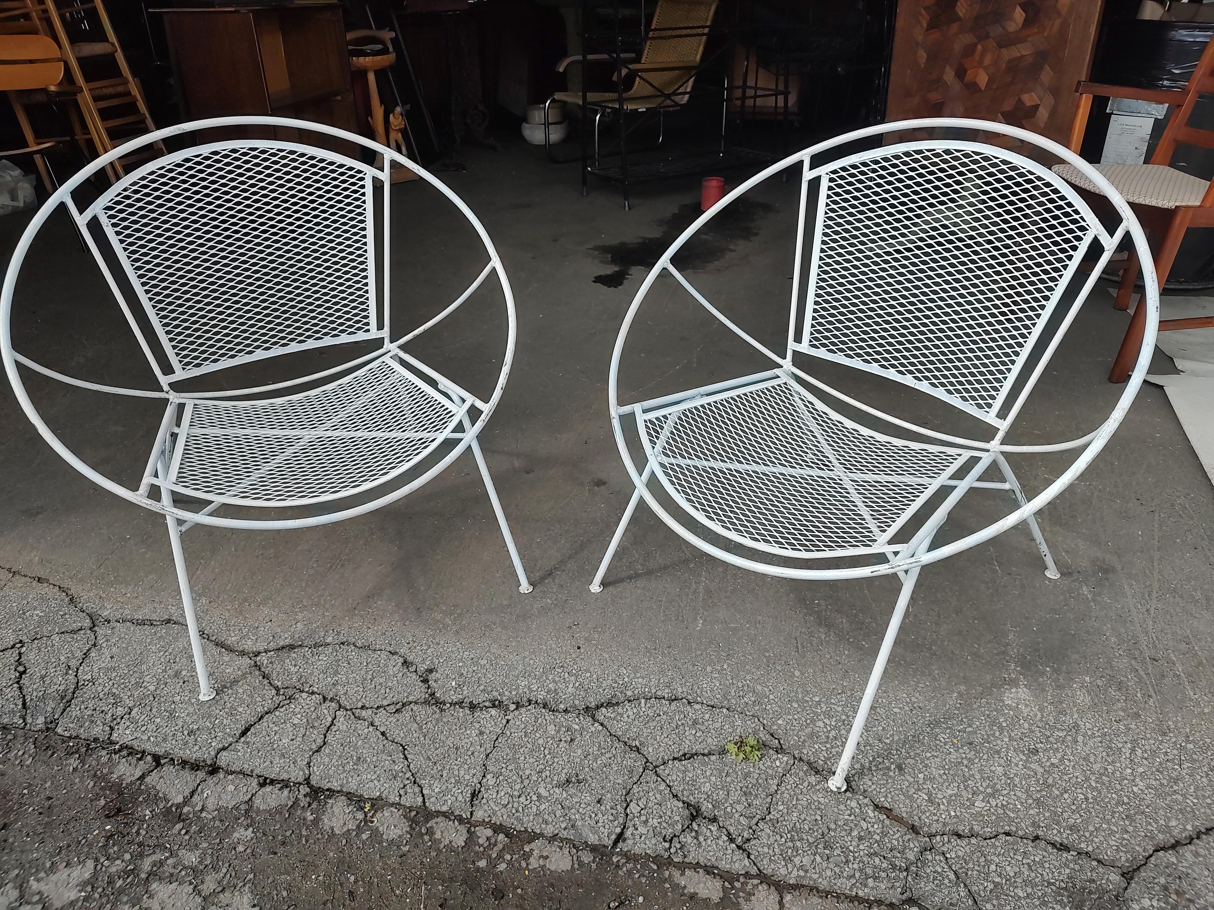 Fantastic pair of Sculptural iron lounge chairs designed by Maurizio Tempestini for John Salterini. circa 1960 hoop radar chairs in old white paint in excellent vintage condition with minimal wear. Sold and priced as a pair. Stylish and comfy.