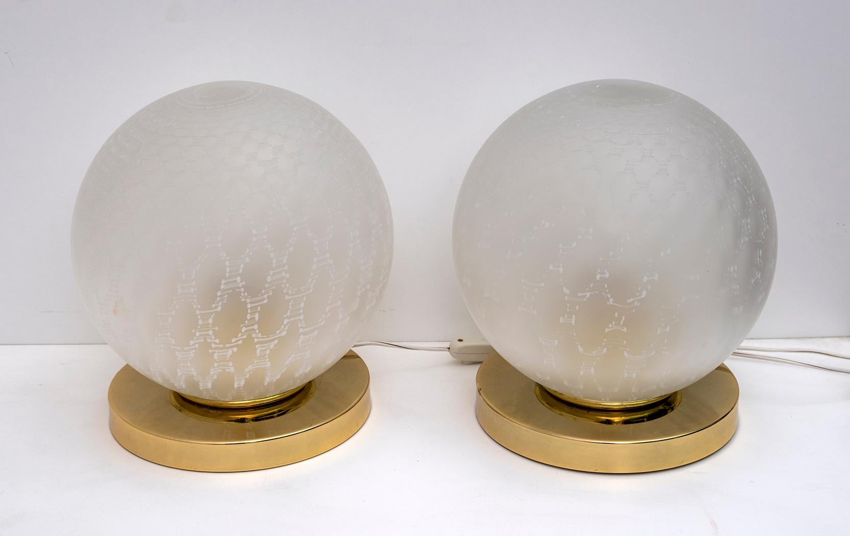 Pair of large sphere lamps in satin-finished Murano glass and brass bases, Italy, 1970s.