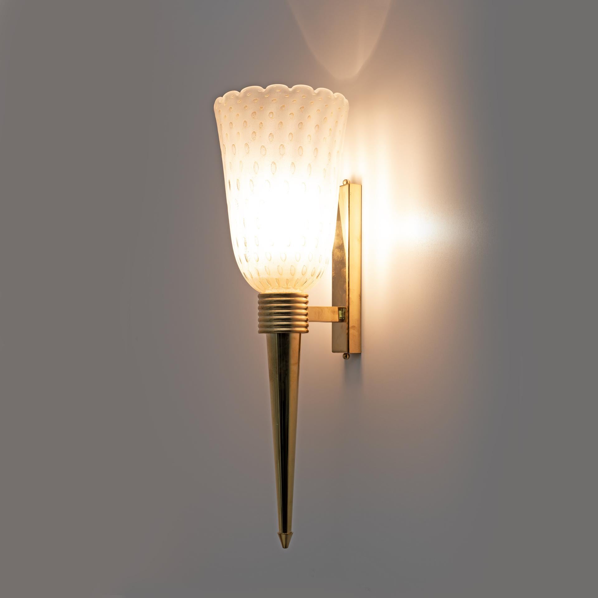 This fabulous pair of Art Deco style Murano glass sconces was made entirely by hand. Everything is decorated with the Pulegoso technique. This means it has large air bubbles inside the high-quality blown glass, made with 24-karat gold dust