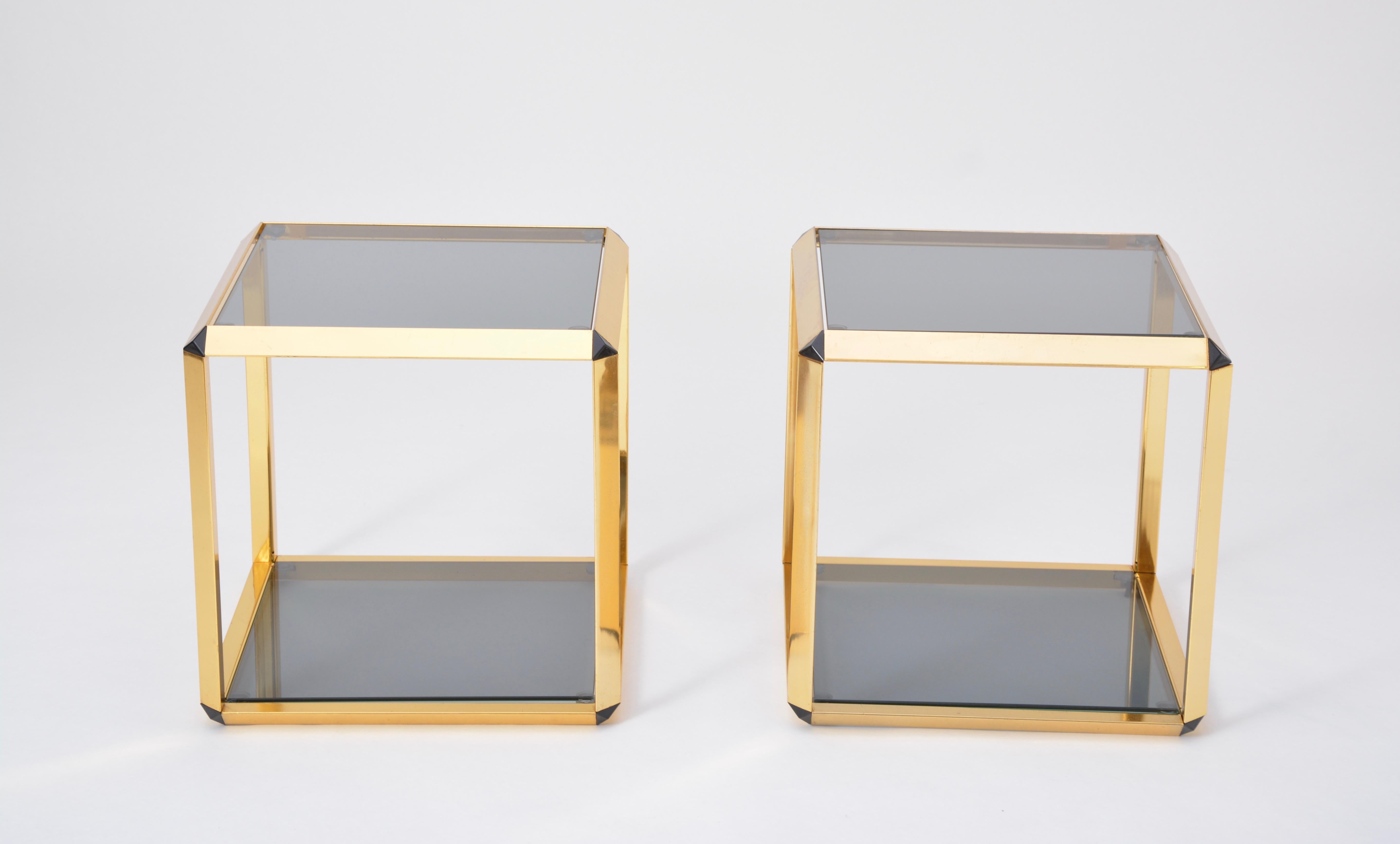 Pair of Mid-Century Modern Italian gold-rimmed metal and glass side tables 
Beautiful and rare pair of low tables in gold-colored steel frames with smoked glass tops produced in the 1970s in Italy. Gold color version 
Glasses, hooks and suction