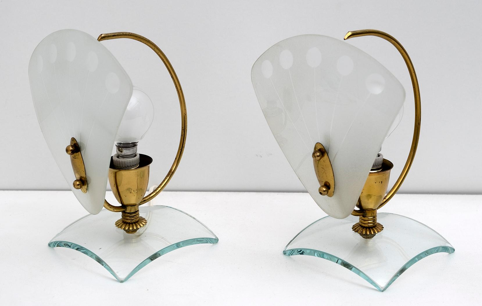 Pair of bedside or table lamps, in brass and satin-finished curved Murano glass.