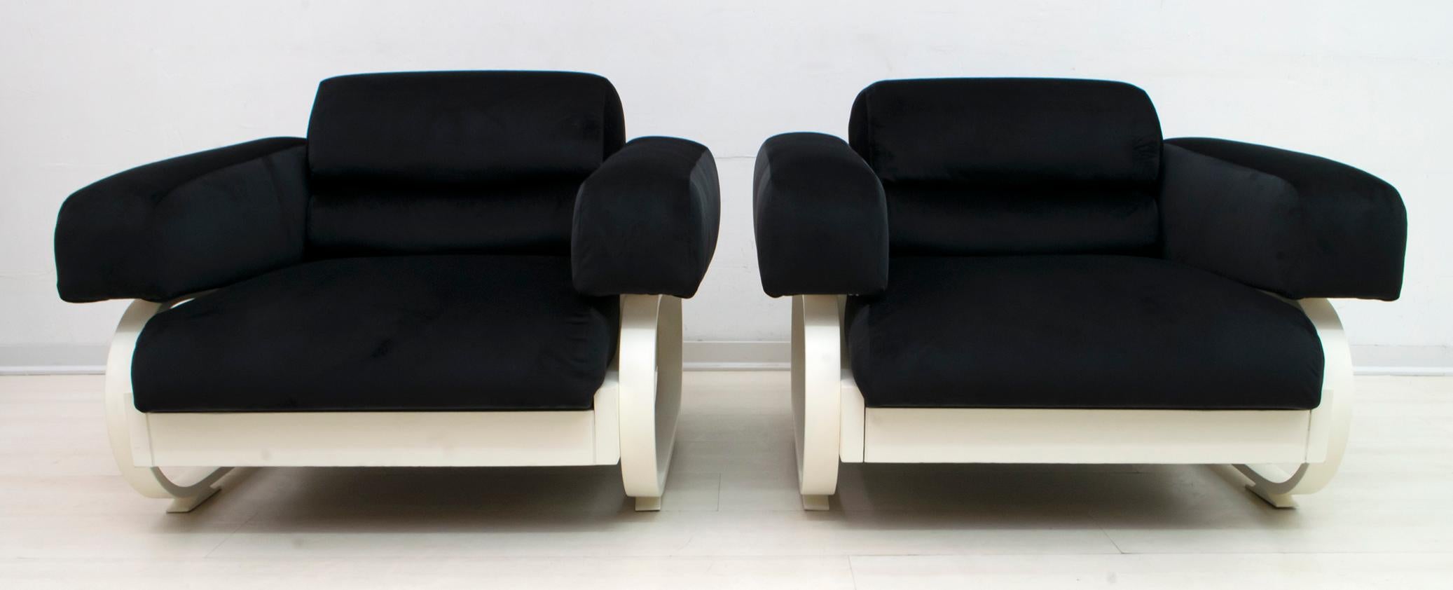 This pair of armchairs, typical Italian design of the 1960s, has been restored and reupholstered in black velvet.