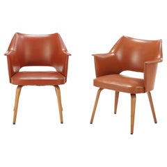 Pair of mid century modern labeled Thonet leather chairs having continuous arms