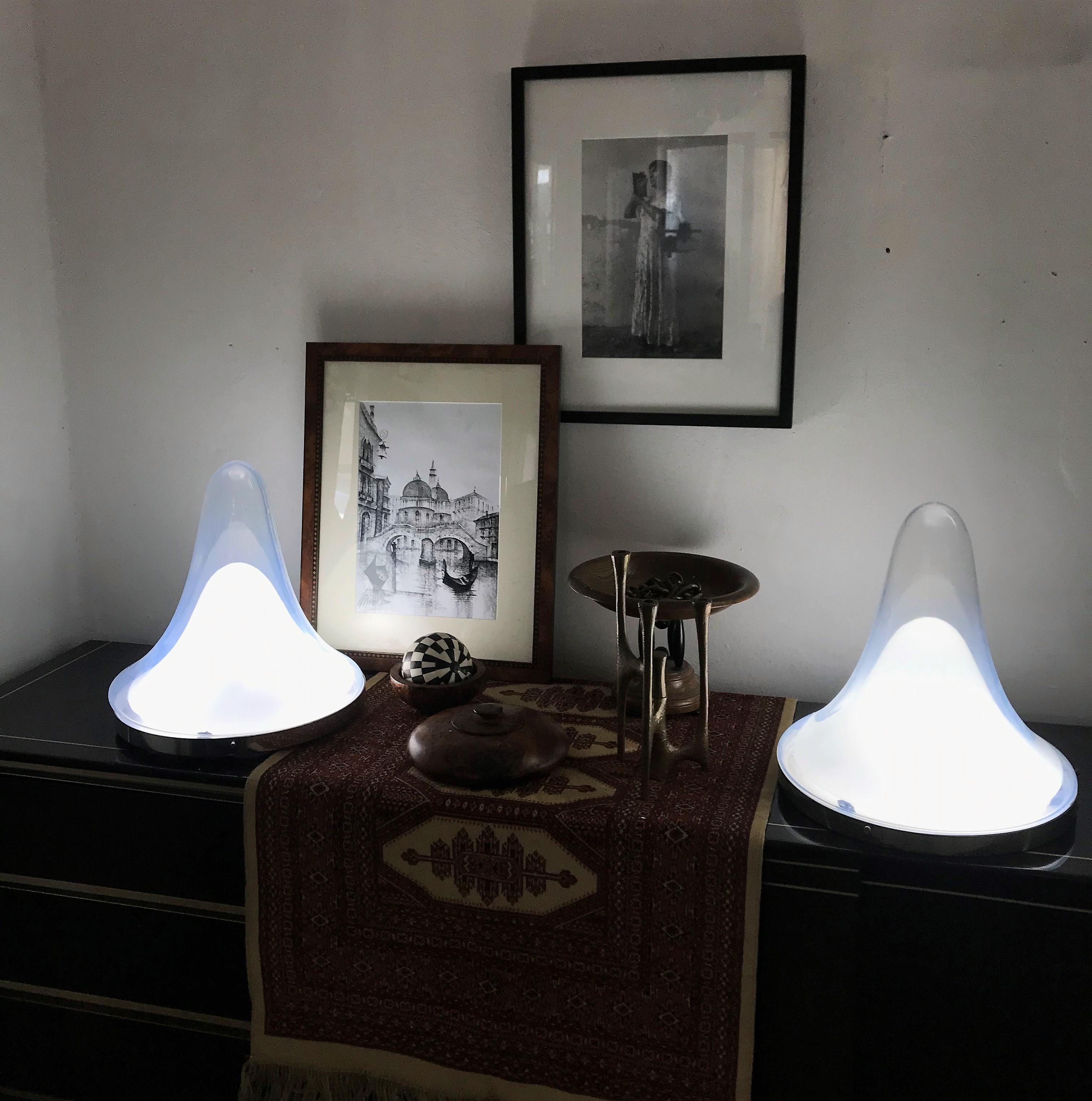 Beautiful pair of Mid-Century Modern table lamps designed by Carlo Nason for Mazzega, circa 1960.
Consists of a small white opaline glass and a larger opalescent one and silver toned hardware.
This lamps can be used as a table, ceiling or wall