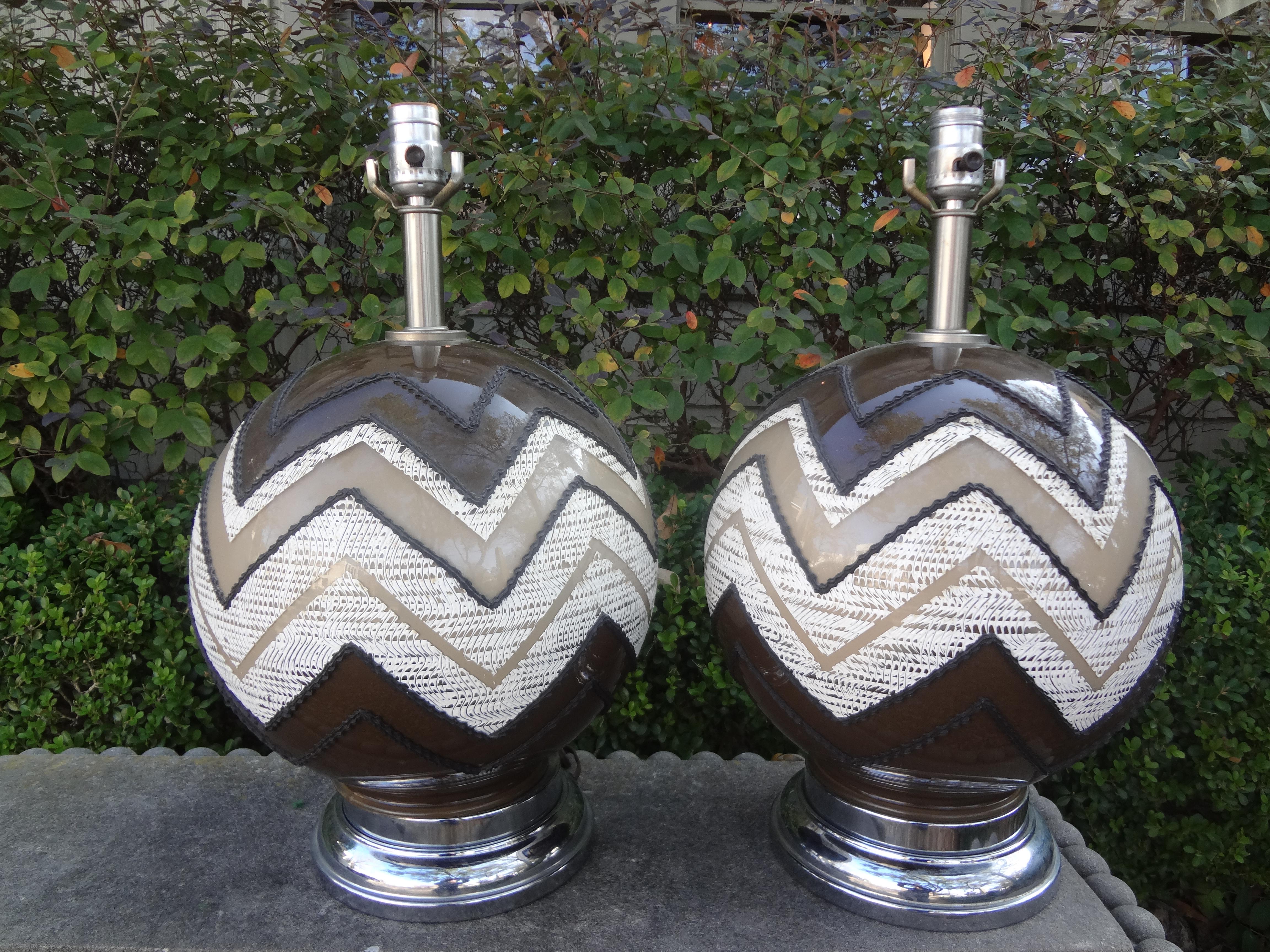 Pair of Mid-Century Modern lamps.
Great pair of Mid-Century Modern glass lamps with a geometric design in neutral tones of brown, white and tan. Our Hollywood Regency or modernist lamps have been newly wired and are ready for your choice of shades.