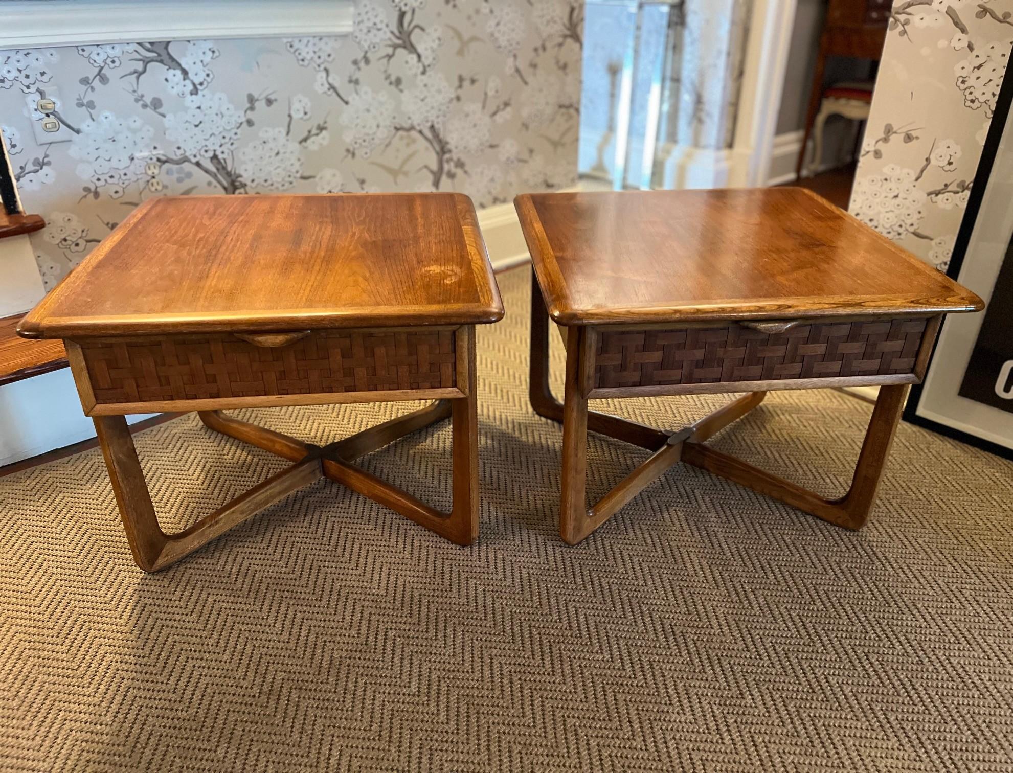 A sculptural and highly collectible pair of end tables from Lane Furniture’s iconic “Perception” line, designed by Warren Church and produced on January 24, 1955. Crafted in warm walnut, these tables feature elegant proportions, a floating top