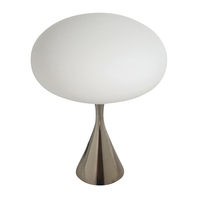 A stunning pair of sculptural mushroom lamps produced by Laurel in the 1970s. These feature cast aluminum bases with white frosted mushroom shades. These have been fully rewired and ready for immediate use.