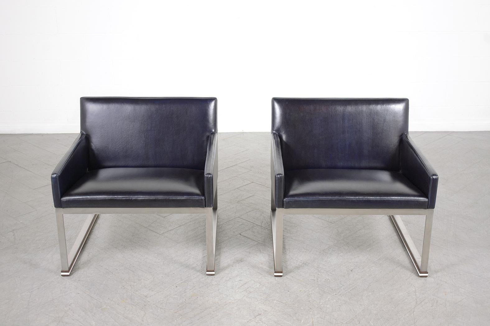 Extraordinary midcentury armchairs beautifully crafted out of leather in great condition completely restored and reupholstered by our expert professional craftsmen team in the house. These lounge chairs feature sleek solid frames made out of steel