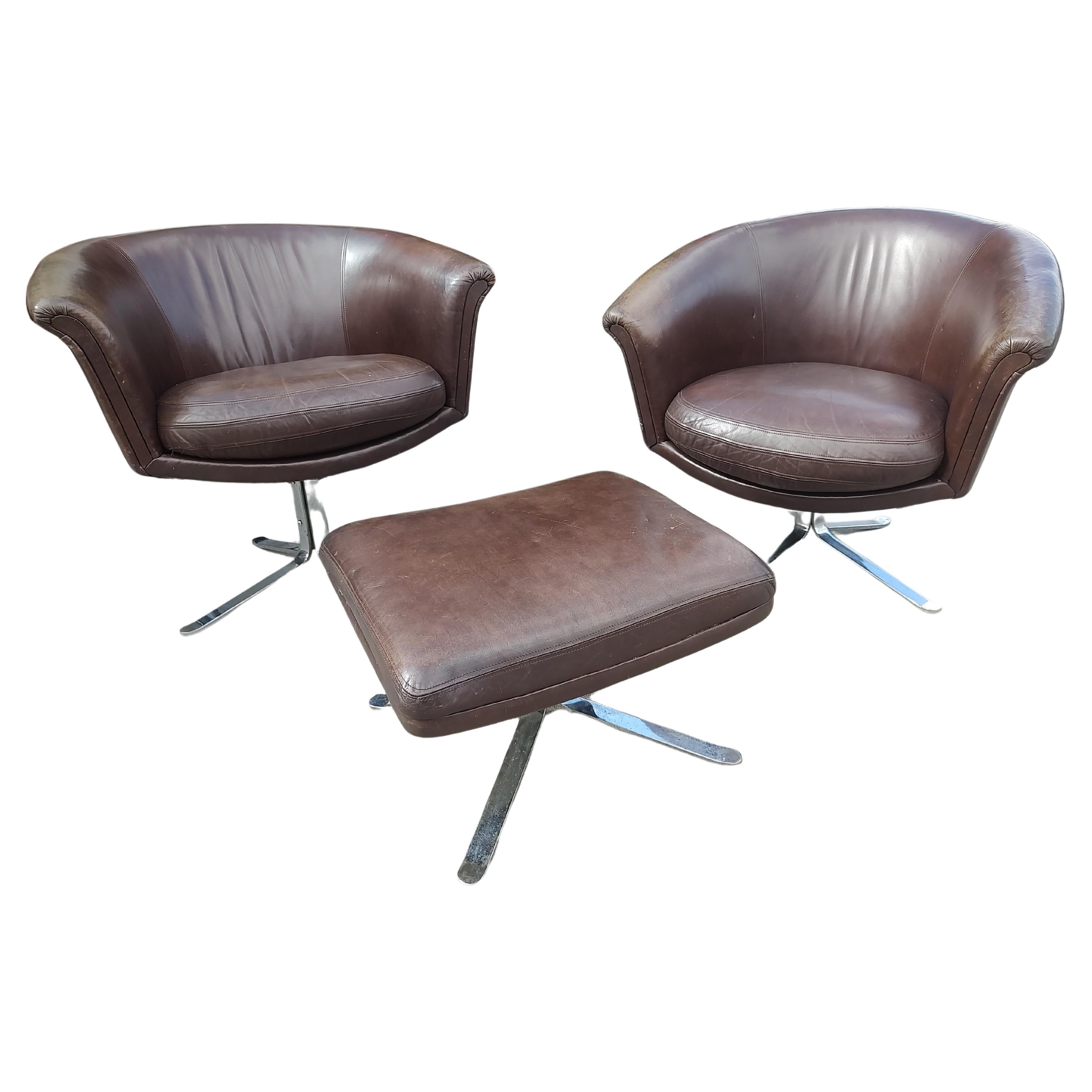 Mid-Century Modern Pair of Mid Century Modern Leather Swiveling Lounge Chairs with an Ottoman C1965 For Sale