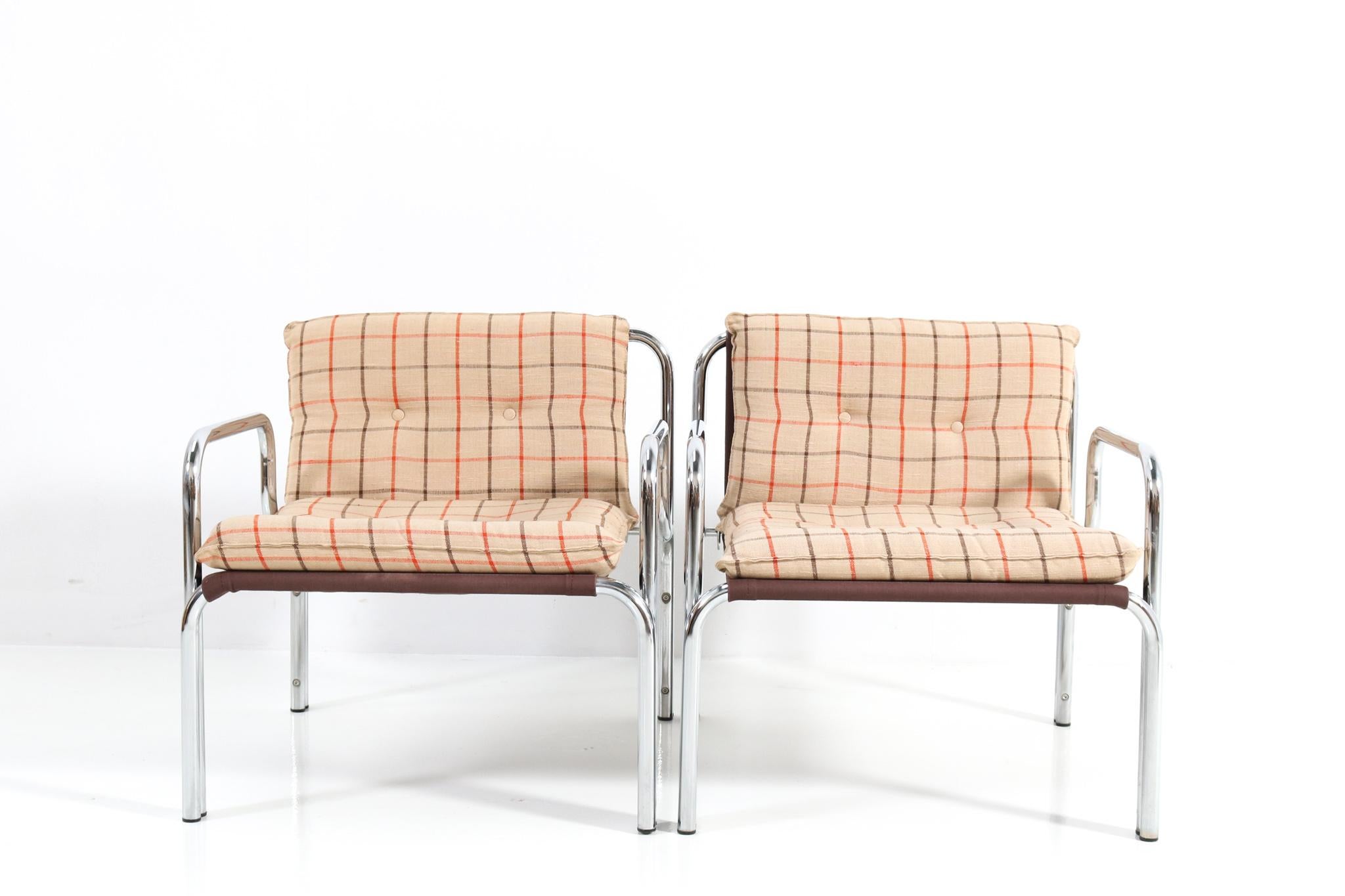 Stunning set of two Mid-Century Modern lounge chairs.
Design by Wim Ypma for Riemersma.
Striking Dutch design from the 1970s.
Chrome plated tubular steel frames with original upholstery.
Marked with original manufacturers label.
This wonderful