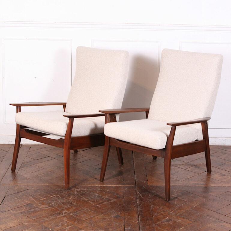 Pair of MCM walnut-framed lounge chairs fully restored with new upholstery, foam and strapping. Elegant and comfortable and suitable for everyday use.


