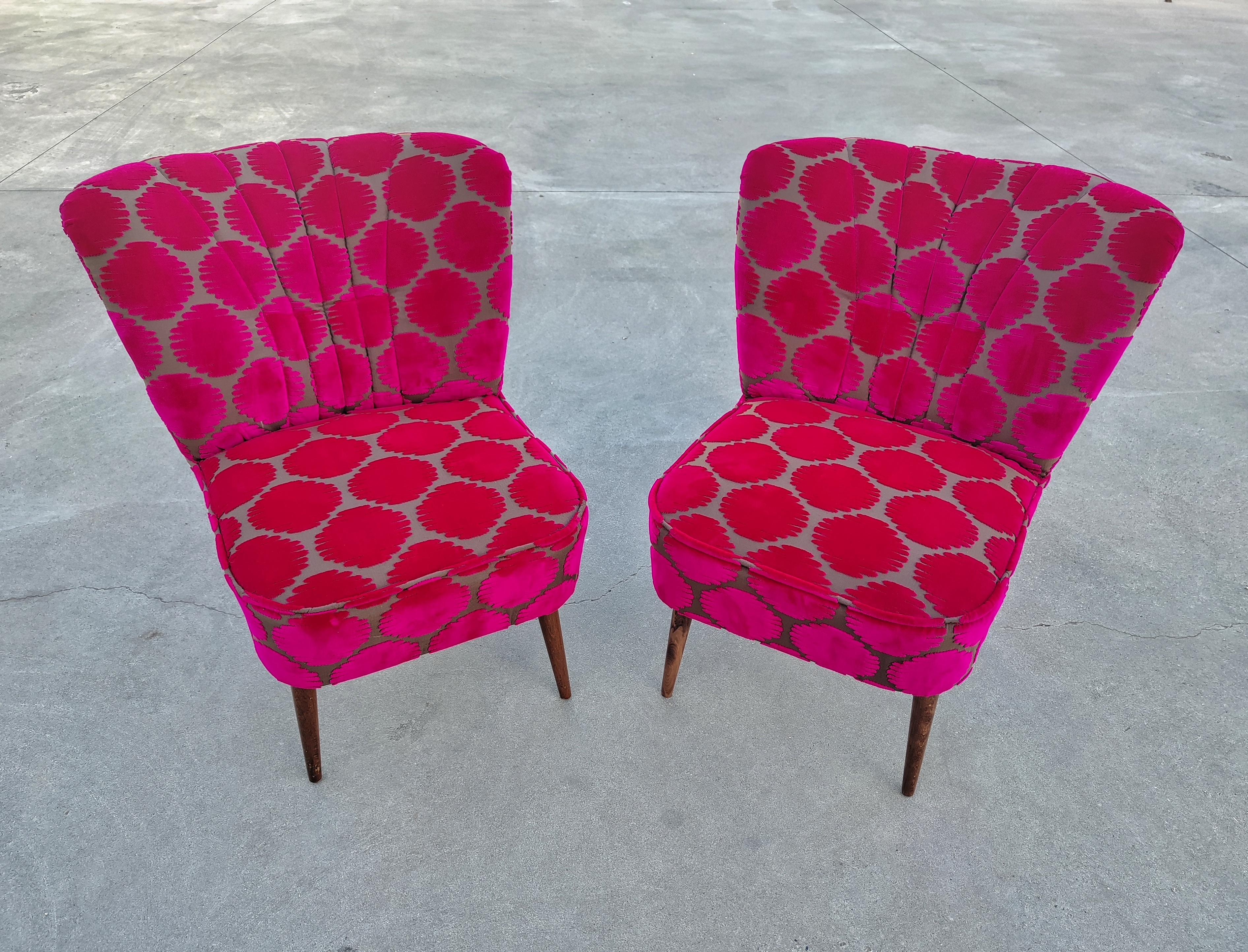 In this listing you will find two Mid-Century Modern Shell Back Cocktail or Lounge Chairs. These two beauties have jut been reupholstered with a luxurious Fuchsia polka dots and gray-ish base fabric, inspired by work of Japsnese artist Yayoi Kusama,