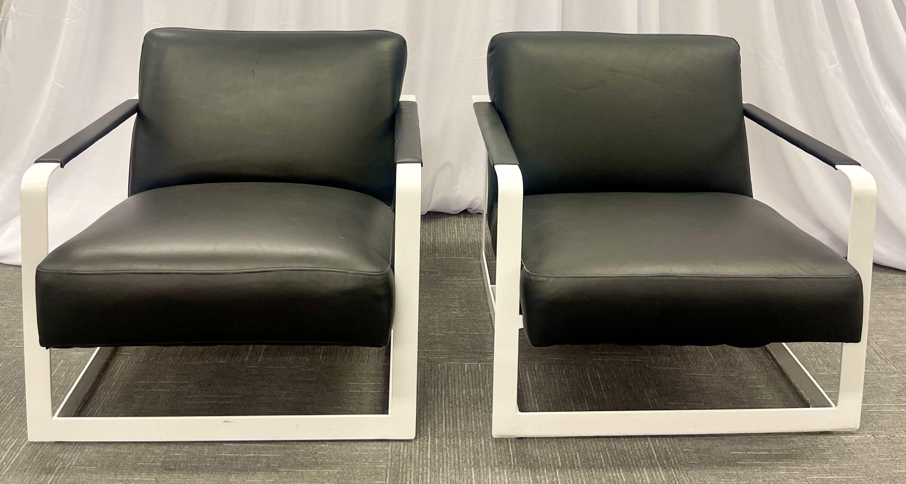 Pair of Mid-Century Modern lounge chairs, leather, steel base, American, 1980s

American designers of the period include Milo Baughman, Paul McCobb, Charles and Ray Eames, Florence Knoll, Edward Wormley, Hans Wegner, or George