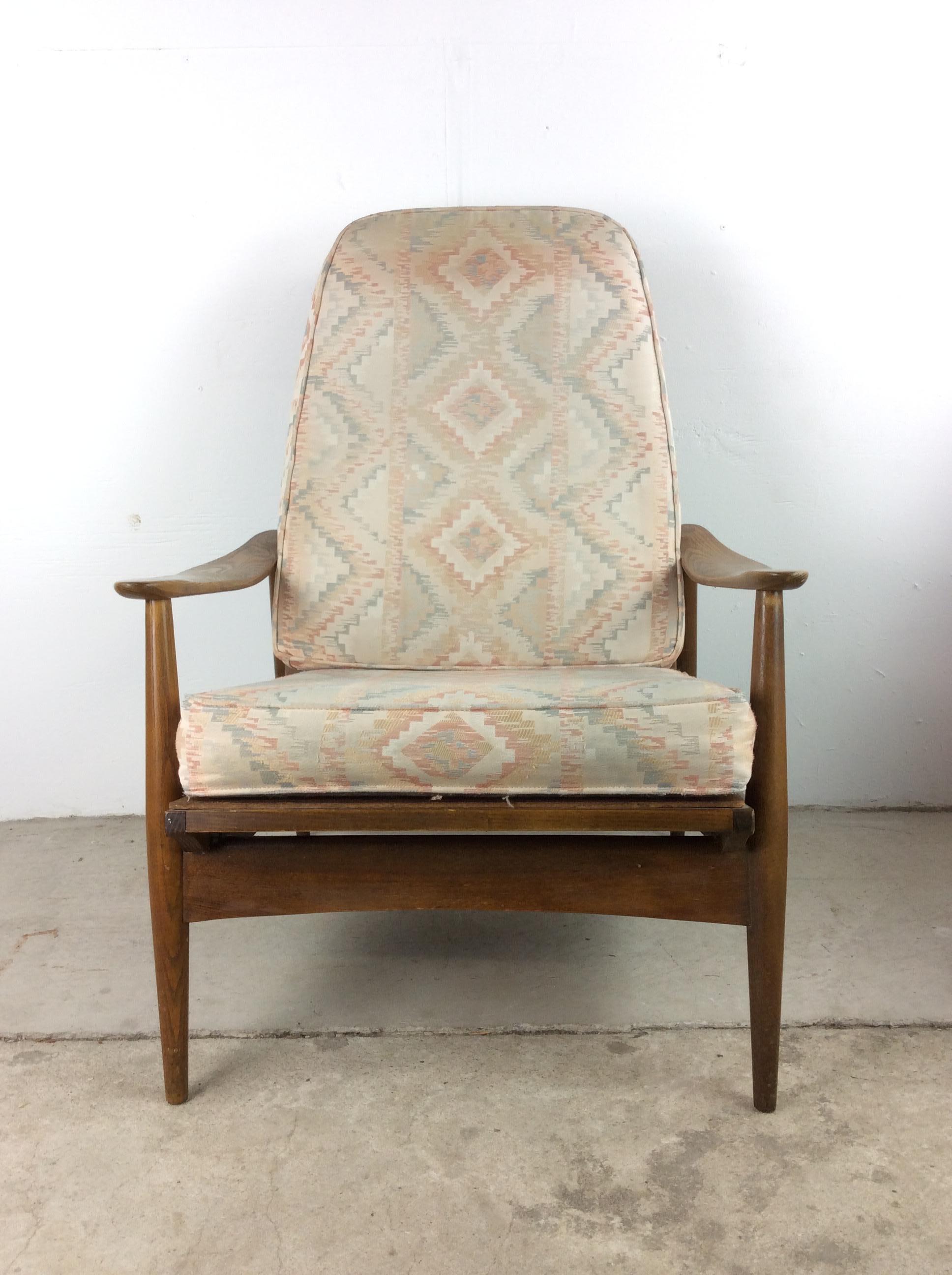 This set of mid century modern chairs feature solid wood construction, original walnut finish, removable cushions with vintage upholstery and tapered legs.

Chair dimensions: 30w 32d 37.5h 21ah 17sh
Ottoman dimensions: 23w 17d 14h

