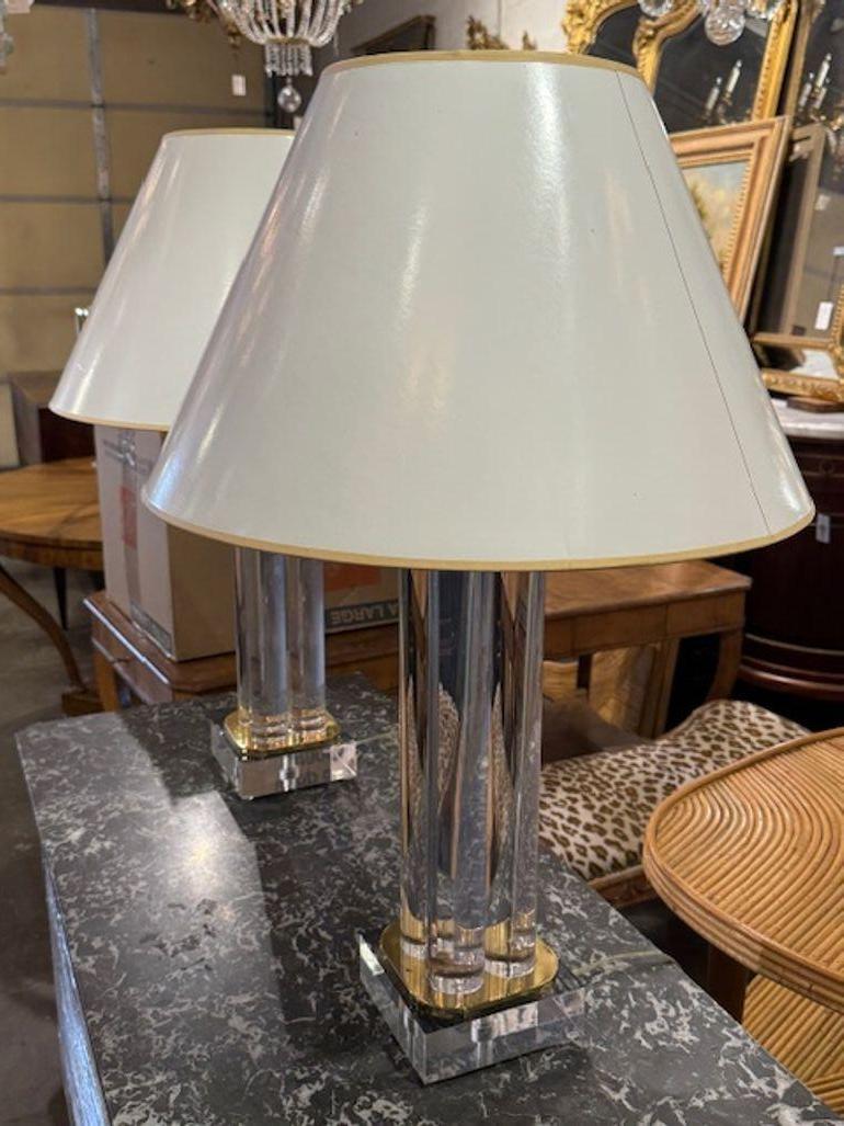 Beautiful pair of Karl Springer Mid-Century Modern lucite and brass lamps.  Elegant and timeless for a fine home.  Circa 1970
30.5h x 20w