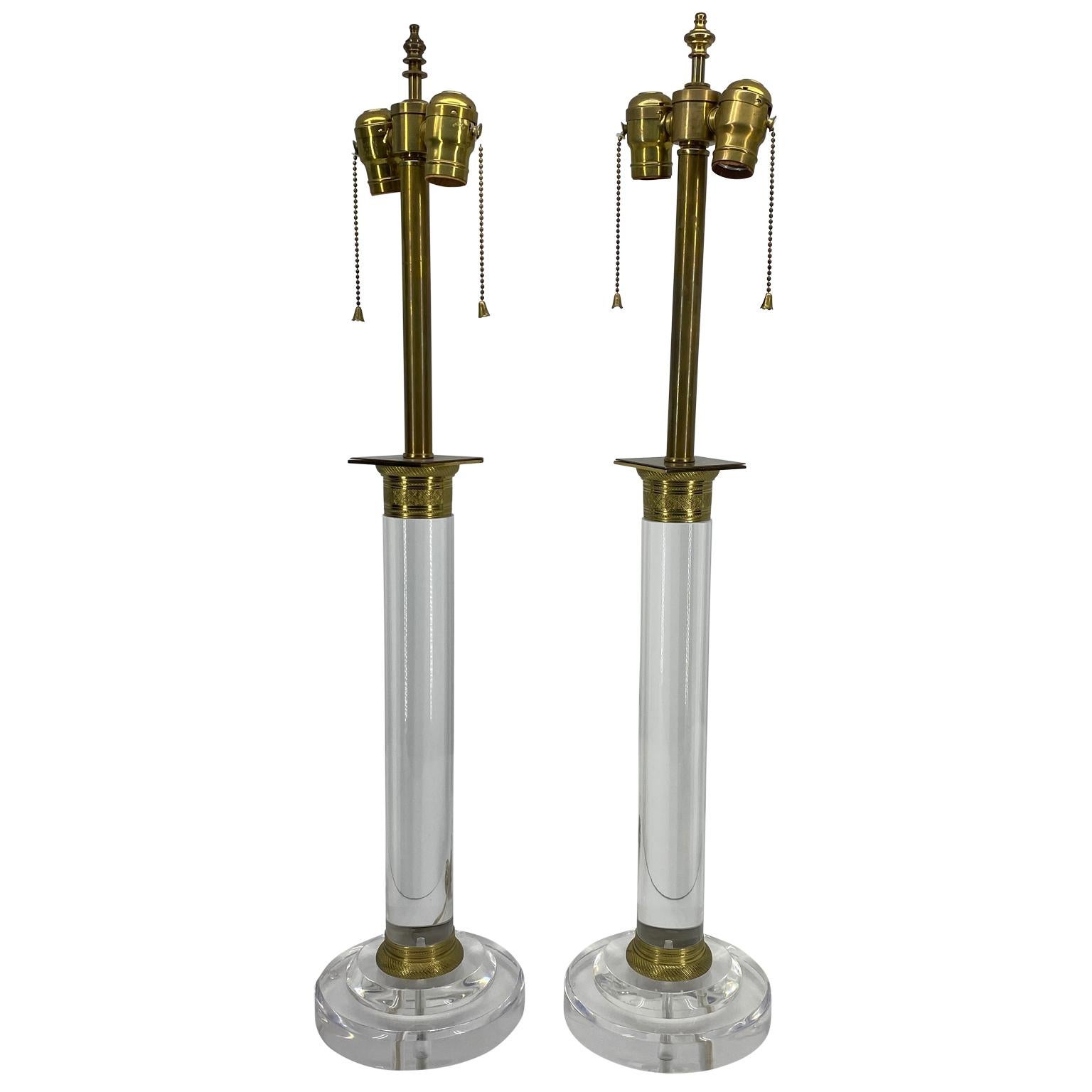 Thick Lucite and gilded bronze table lamps, 20th century, America.