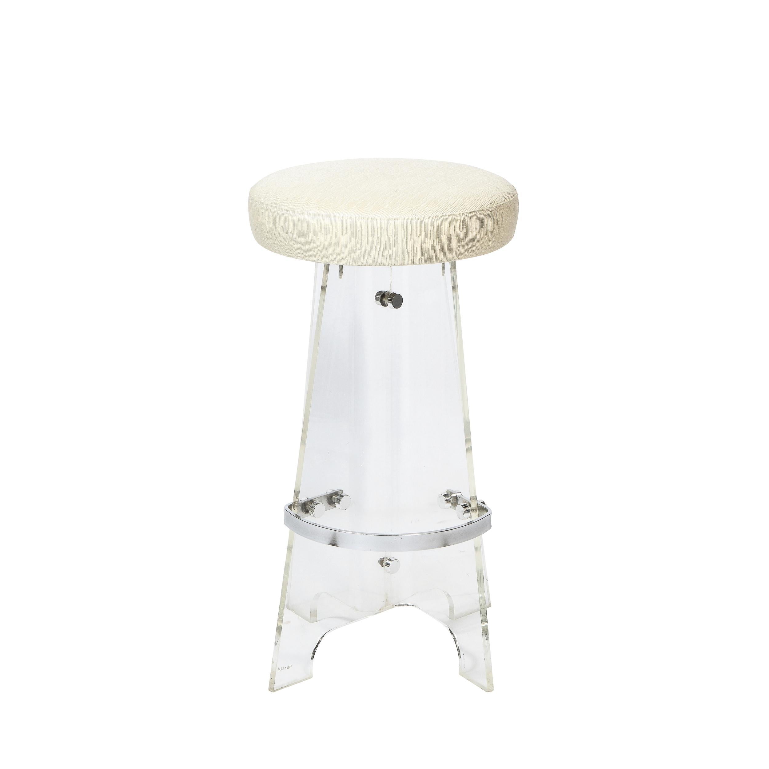This refined pair of Mid-Century Modern bar stools were realized in the United States circa 1970. They feature sculptural scalloped bases in translucent lucite with a demilune chrome support on each. With their clean modernist lines and