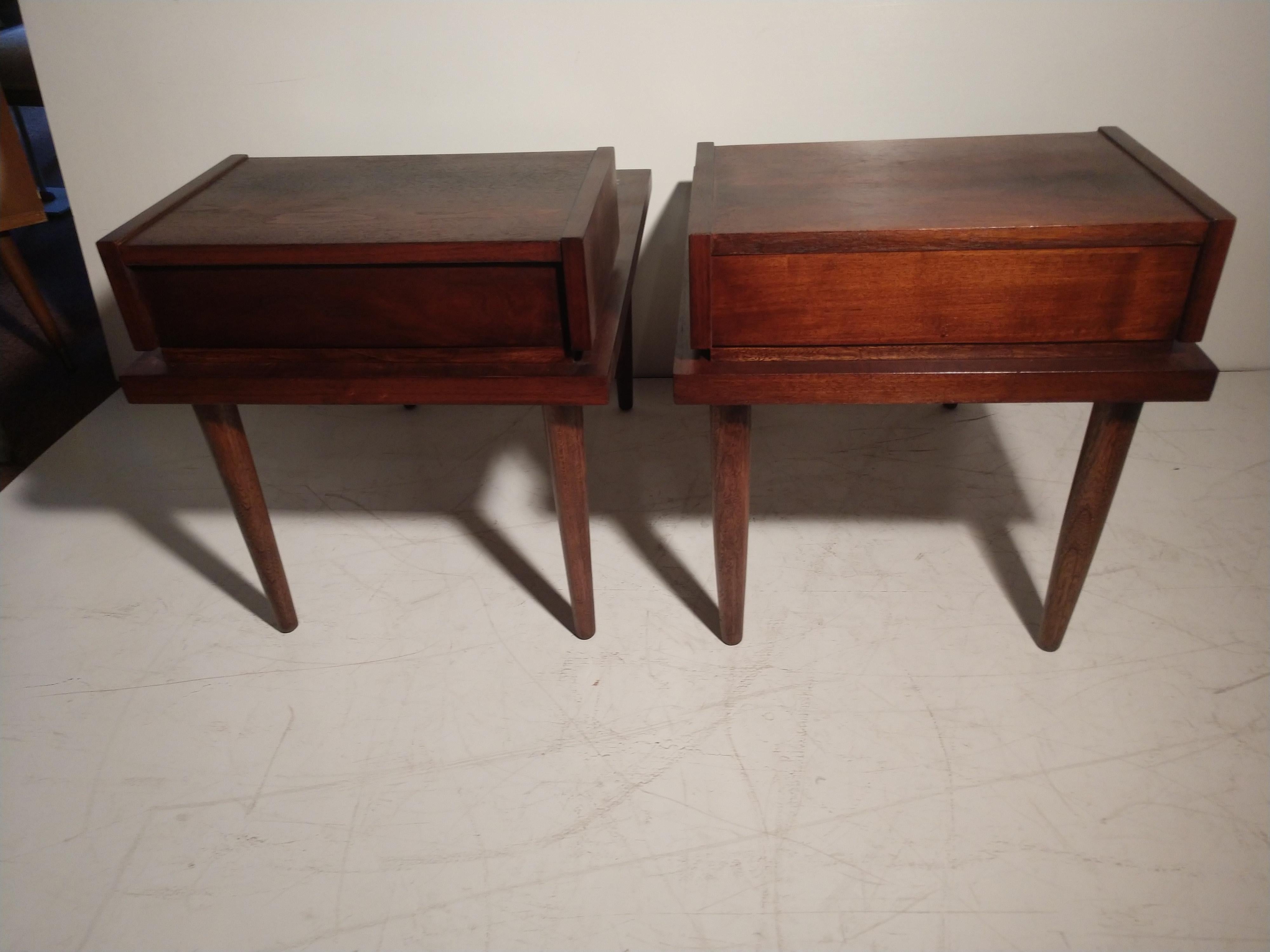 Fabulous pair of Mid-Century Modern end/side tables with a single drawer. Drawer dimensions are 15.75 x 9.25 x 2 H. Tables have been refinished and in great working order. Original drawer pulls have been changed to a similar style. Only one was
