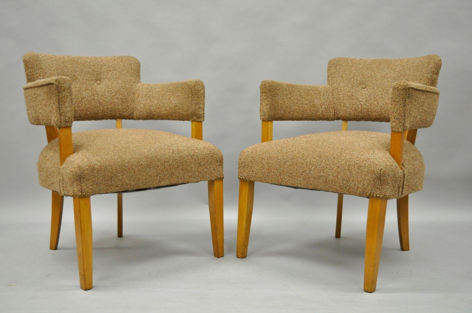 Pair of vintage Mid-Century Modern maple wood club chairs in the manner of Jens Risom and Heywood Wakefield. Item features solid wood frames, tapered legs, upholstered back and seats, great sculptural form, and quality vintage chairs, circa