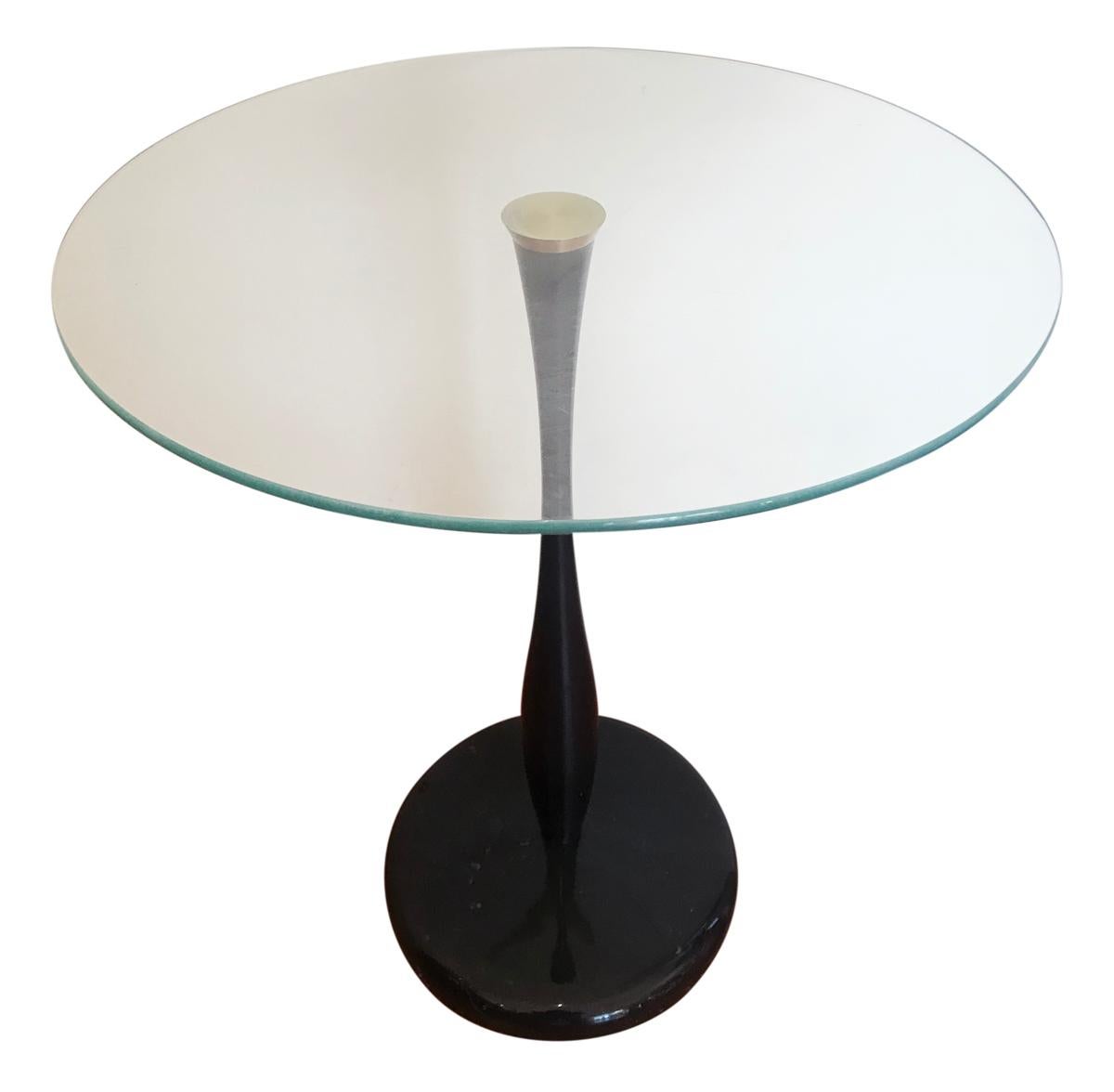 A handsome matching set of glass drink tables designed and produced by Kaiser Newman in the 1990s. The tables features a black polished stone base and a spun aluminum stem with glass top. Clean ready to use condition.