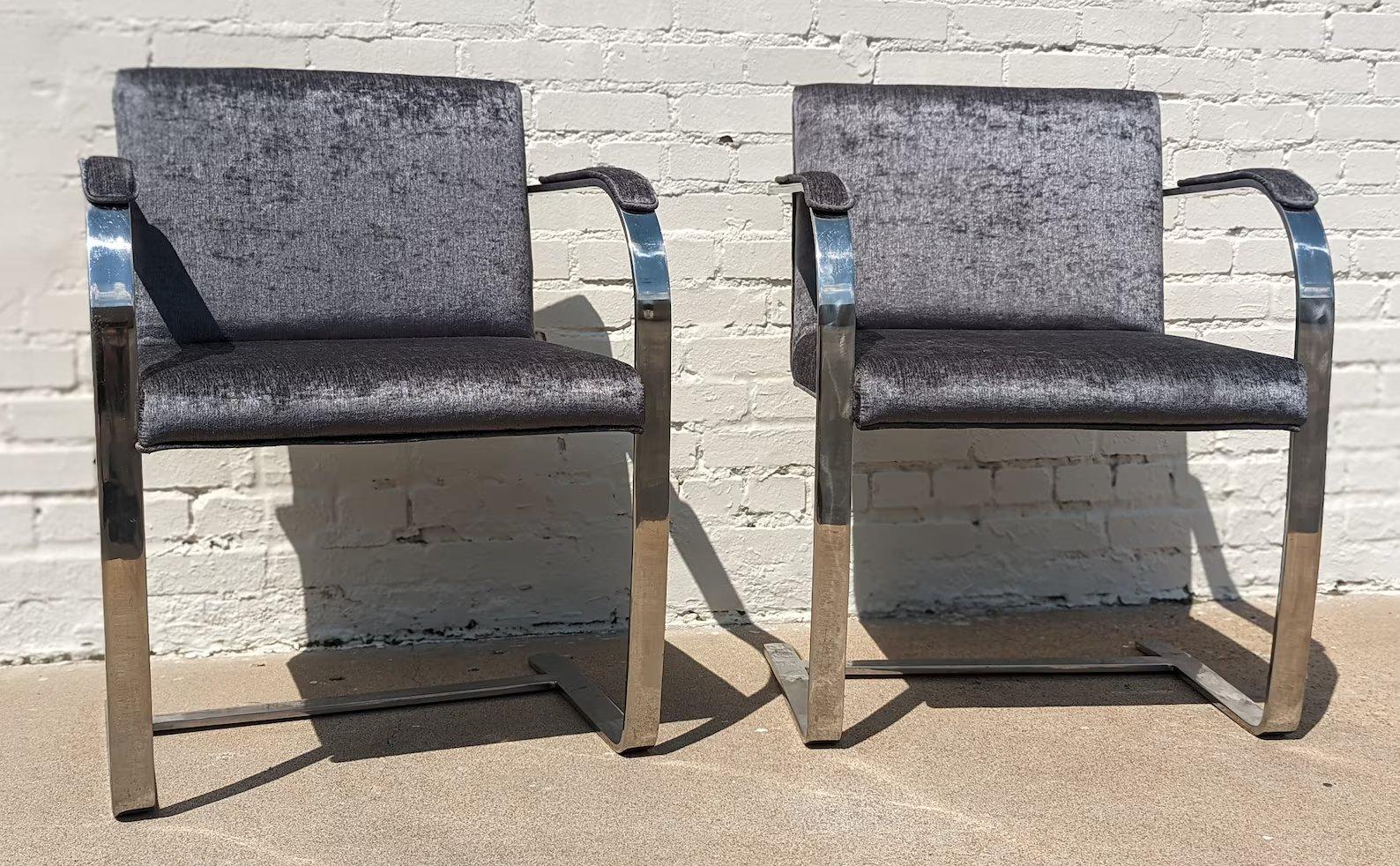 Pair of Mid Century Modern Mies Van Der Rohe Flatbar Chairs

Sold as pair. Above average vintage condition and structurally sound. Has some expected slight finish wear on stainless steel. Fabric is new. Outdoor listing pictures might appear slightly