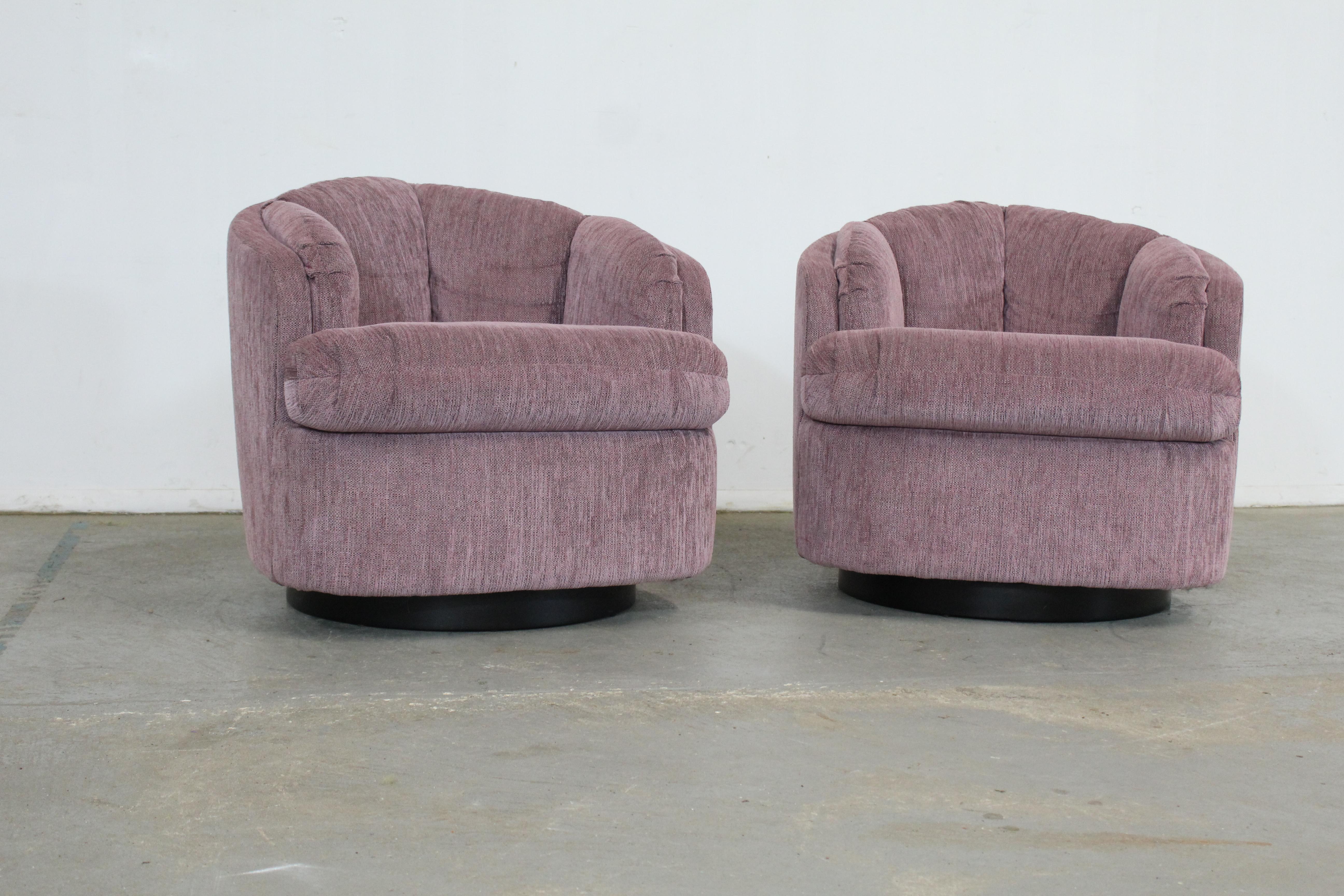 Pair of Mid-Century Modern Milo Baughman style swivel club chairs. 

 Offered is a pair of Mid-Century Modern Milo Baughman style swivel rocker chairs. These chairs rock and tilt. They are on a platform base. This unique pair could stand to have