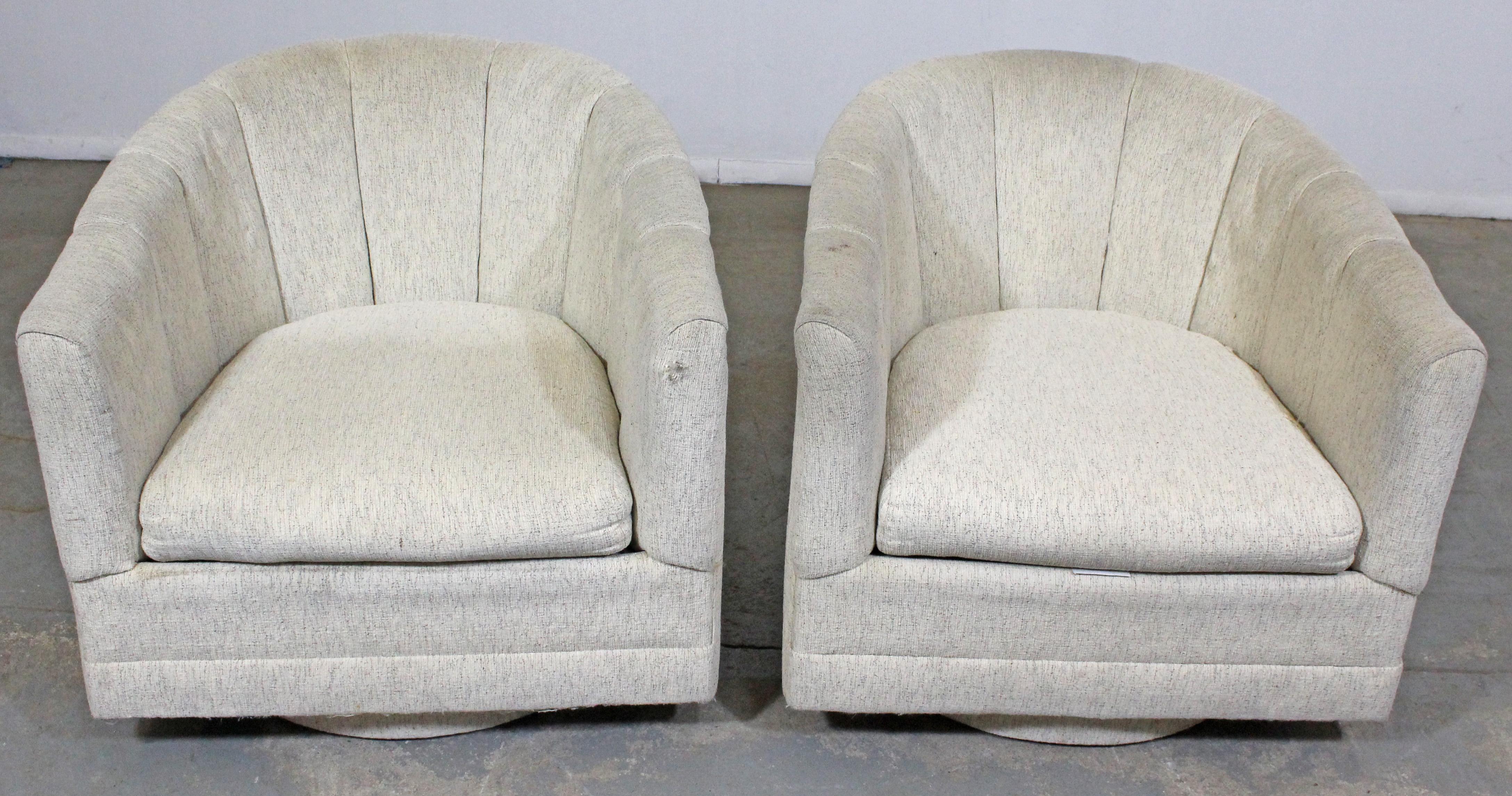 What a find. Offered is a pair of Mid-Century Modern swivel chairs by Precedent, circa 1970s. They are in fair vintage condition (tears, stains, age wear). Need to be reupholstered, make a great template for restoration. They are signed by