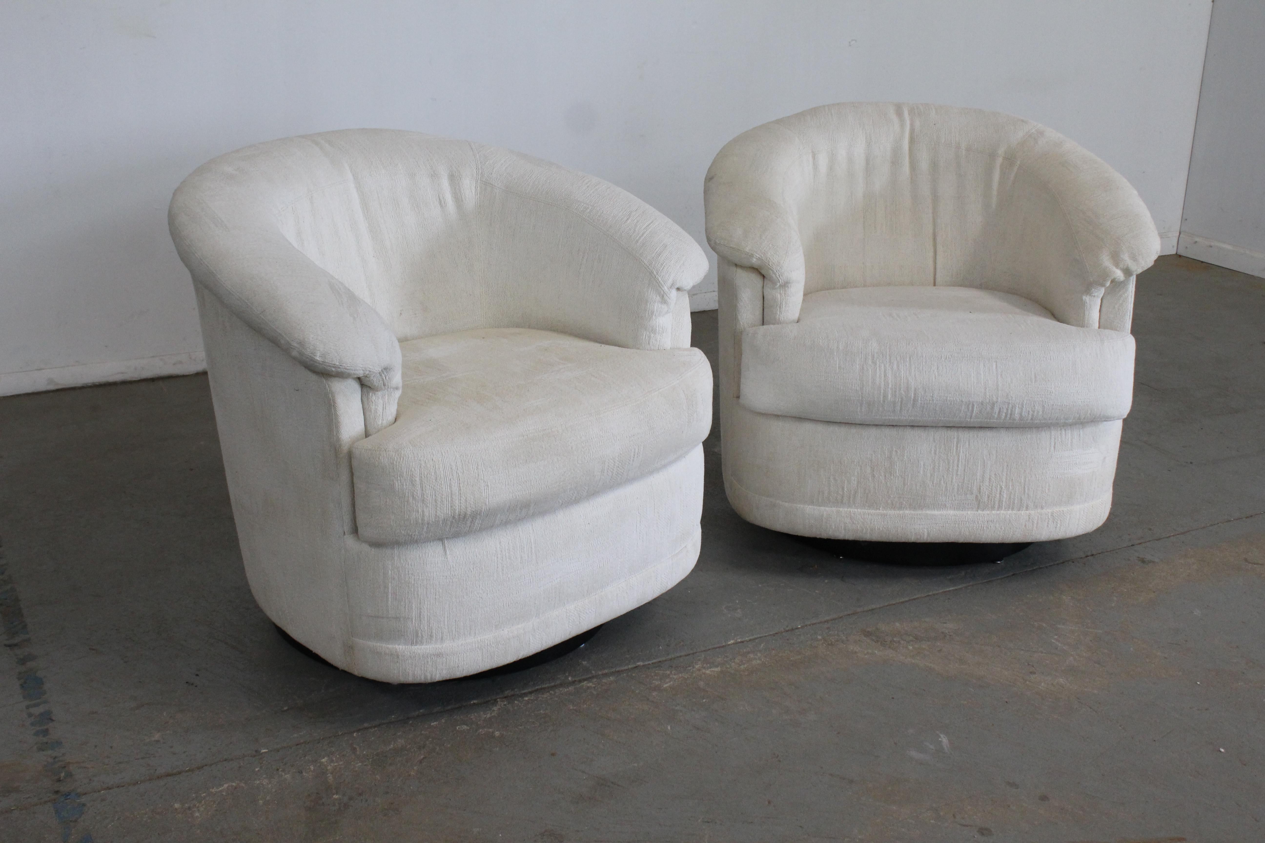 Pair of Mid-Century Modern Milo Baughman style swivel rocker club chairs.

 Offered is a pair of Mid-Century Modern Milo Baughman style swivel rocker chairs. These chairs rock and tilt. This unique pair need new upholstery or a serious steam