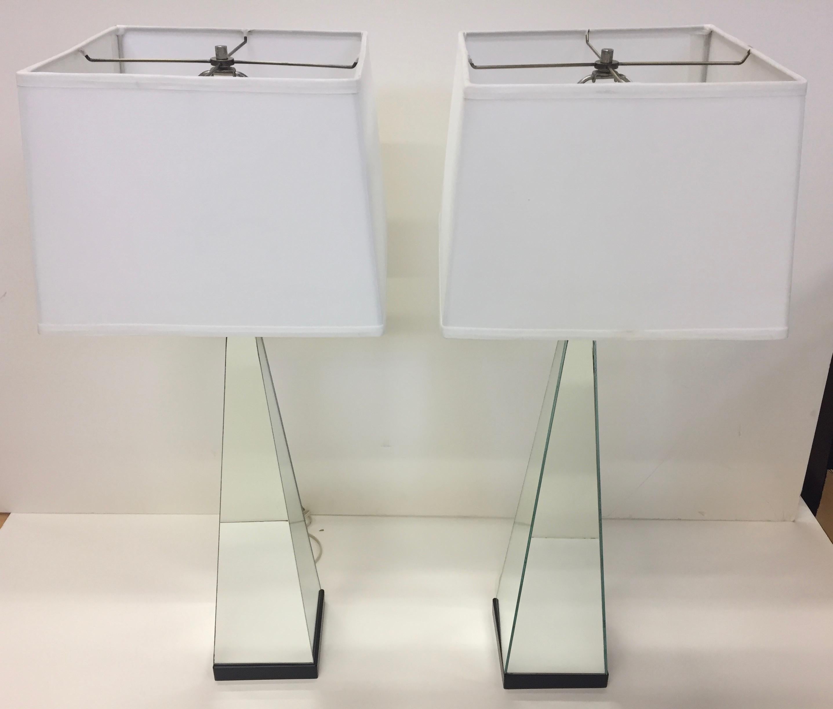 Cool pair of 1960s of mirrored obelisk shaped lamps with black bases.
Shades not included.