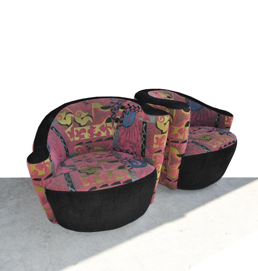 Classic Kagan design

Midcentury nautilus chairs with a sculptural profile on a swivel base. 
Fabric is a multi-color patterned textile on seats and back with black trim on the top and base. 

Fabric is in very good condition. 

 