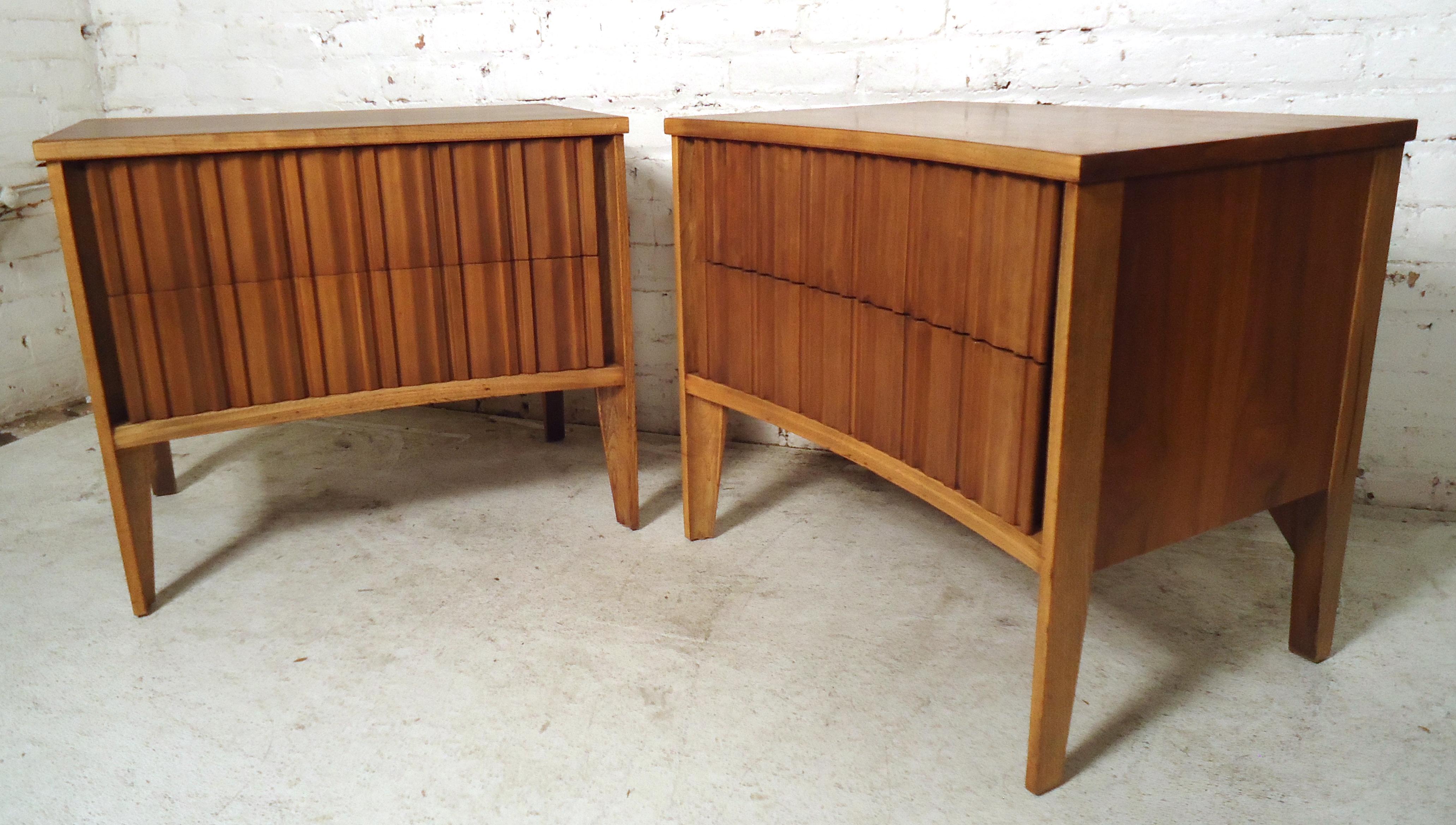 Vintage modern pair of nightstands featuring a uniquely designed drawers and curved front.
(Please confirm item location - NY or NJ - with dealer).