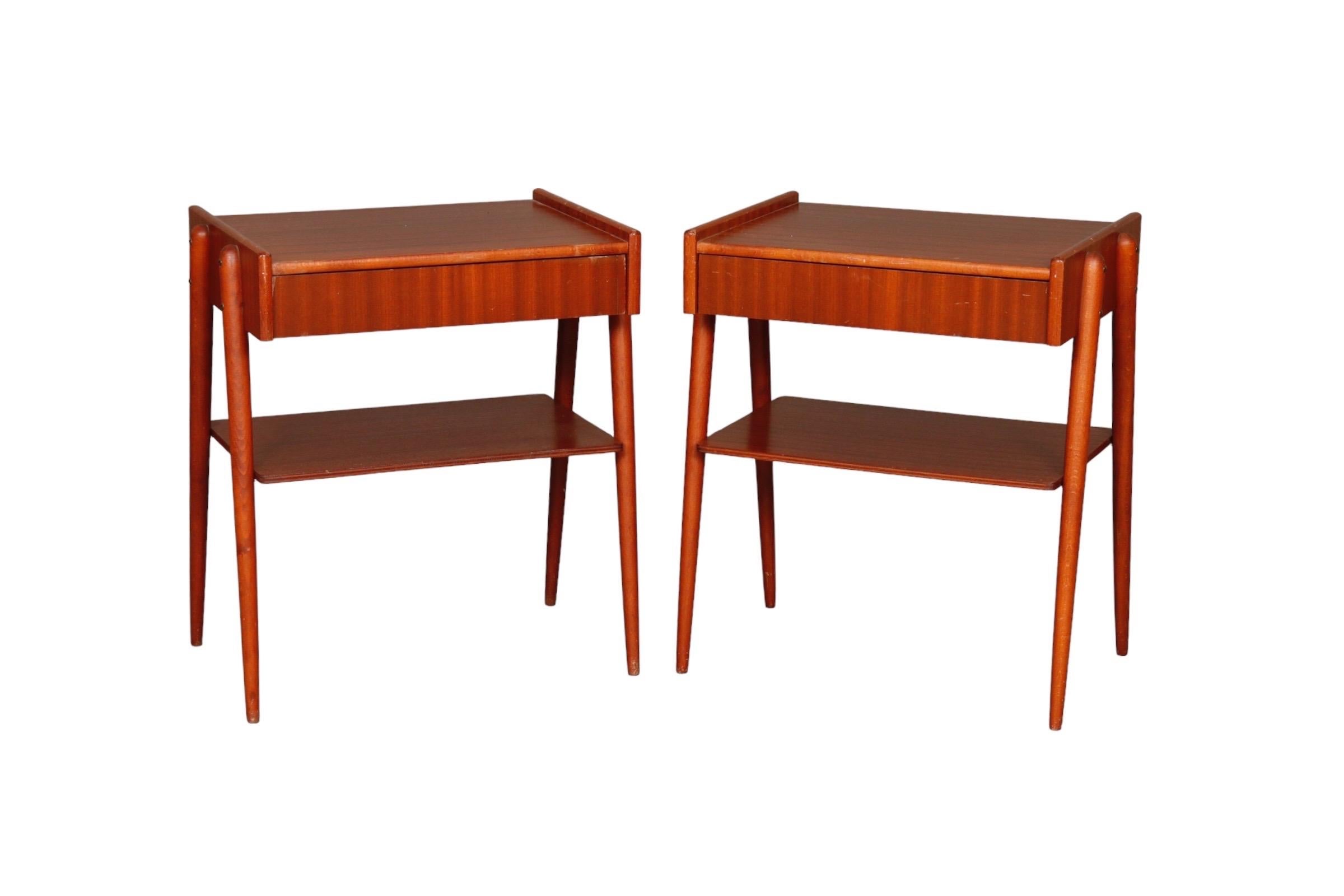 Pair of Mid-Century Modern nightstands by Carlström & Co Möbelfabrik. Made of teak with a single dovetailed drawer above a shelf.

Measures: W17” x D13” x H21”.