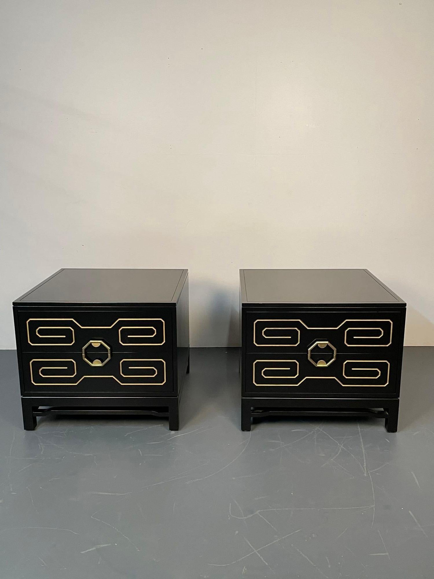 Pair of Mid-Century Modern nightstands / Dressers, Greek Key, Mastercraft Style
 
Low profile set of ebony nightstands having recessed Greek key gilt inlay and original Asian inspired brass handles. Recently refinished in a black satin ebony