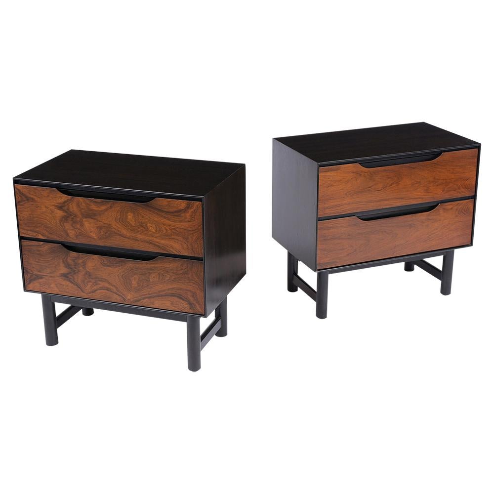 This set of Mid-Century Modern nightstands are made out of rosewood and has been completed restored. These side tables feature an exceptional rosewood grain design, and a newly stained ebonized and rosewood color combination with a lacquer finish.