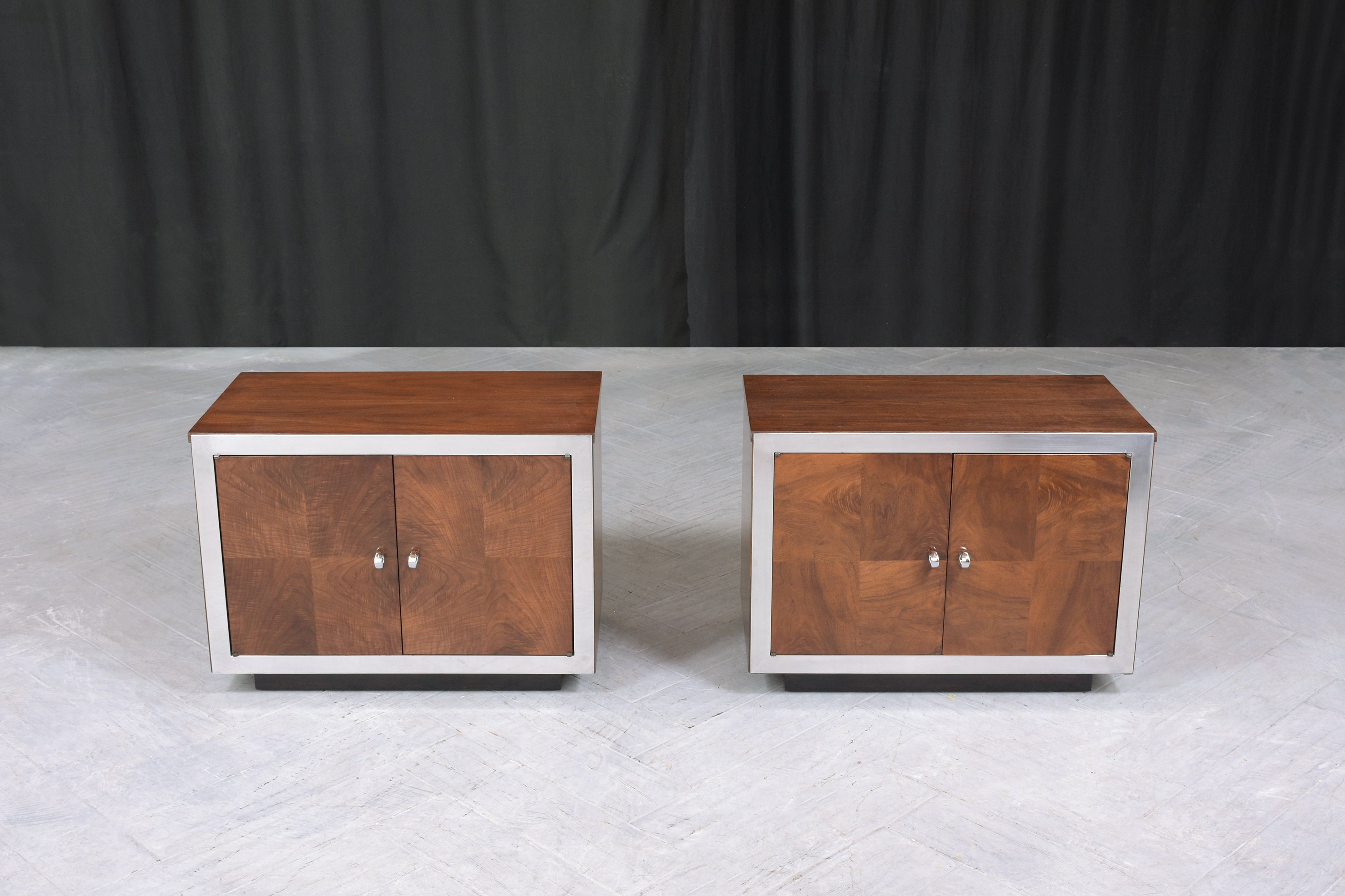 This pair of vintage mid-century modern walnut nightstands are in great condition handcrafted out of solid wood with exotic walnut veneers and have been completely restored by our professional expert craftsmen team. This sleek design pair of 1960s