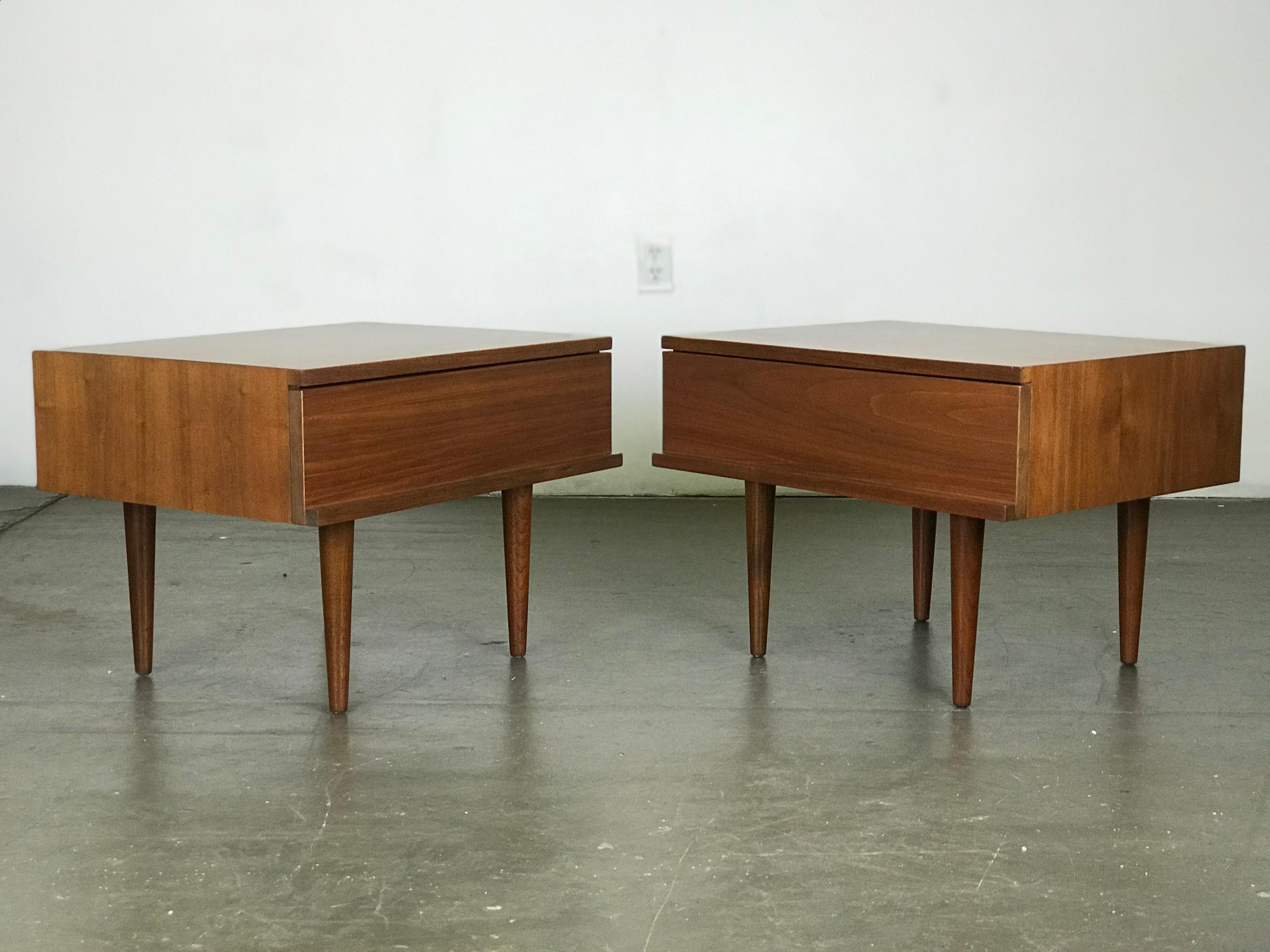 Scarce pair of Mel Smilow walnut nightstands for Smilow-Thiel furniture, 1950s. Refinished. Beautiful walnut grain.
*The legs unscrew making these tables shippable by parcel post. Please see that option for shipping.
**Reduced cost and or