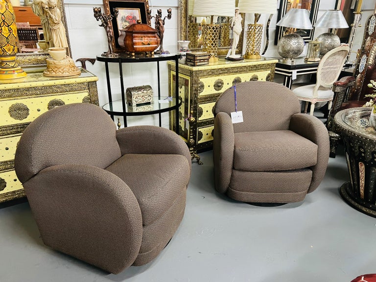 A timeless pair of Pace by Directional Leon Rosen style swivel lounge chairs. Told by the past owner that this Fine pair of swivel arm chairs were purchased by pace and are by Leon Rosen however, we can not find any labels other than the Directional