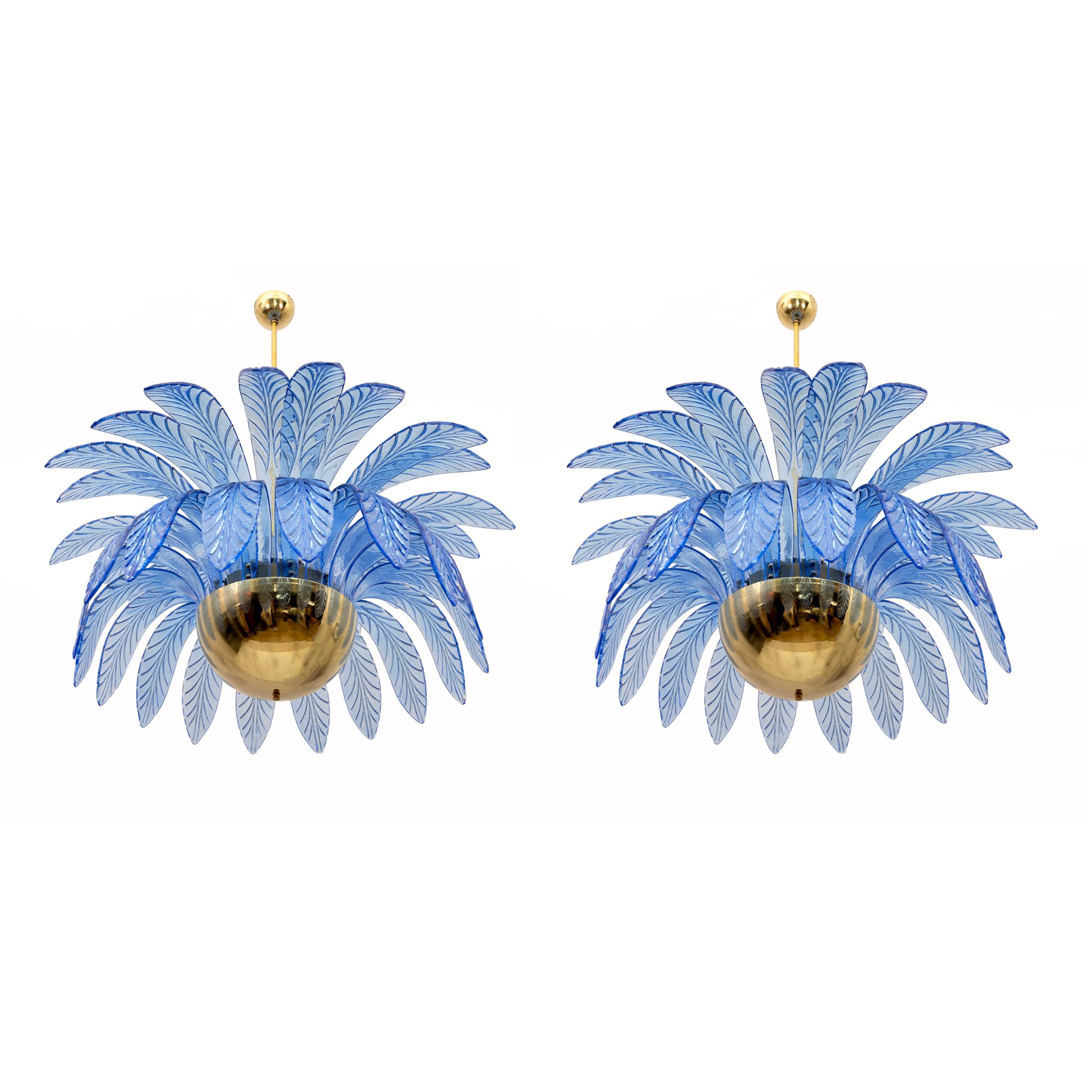Pair of large mouth-blown Murano glass chandeliers, 38 blue Murano glass leaves each, brass frame, 12 bulbs. The chandelier reproduces the crown of a palm tree. Rewired for E14 or E12 bulbs for the USA. The minimum height, if you want to shorten the