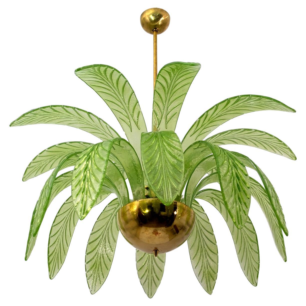 Pair of mouth blown Murano glass chandeliers, each has 20 green Murano glass leaves, brass structure, three bulbs.
The chandelier reproduces the crown of a palm tree.
We supply reducers for USA E12 bulbs.