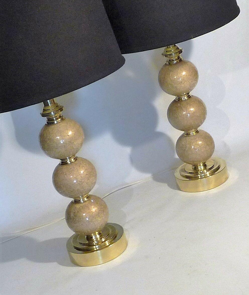 For your consideration is this monumental pair (2) of vintage Paul Hanson Mid-Century Moderne mod hollywood regency moderne retro eames era crackle art glass brass based classic ball form tall scale table lamps. Repolished brass elements. Crackle