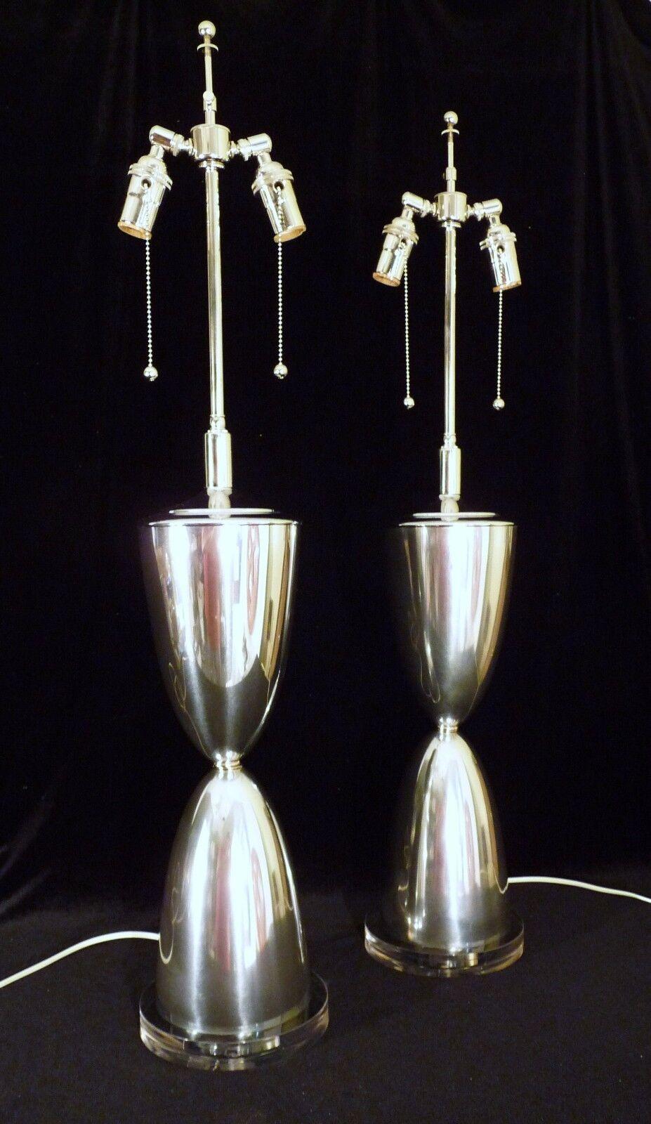 For your consideration are these matched pair of mid century modern parabolic form moderne retro atomic space age Eames Era Googie polished aluminum lucite based table lamps lights. In excellent vintage condition with new wiring and acrylic base,