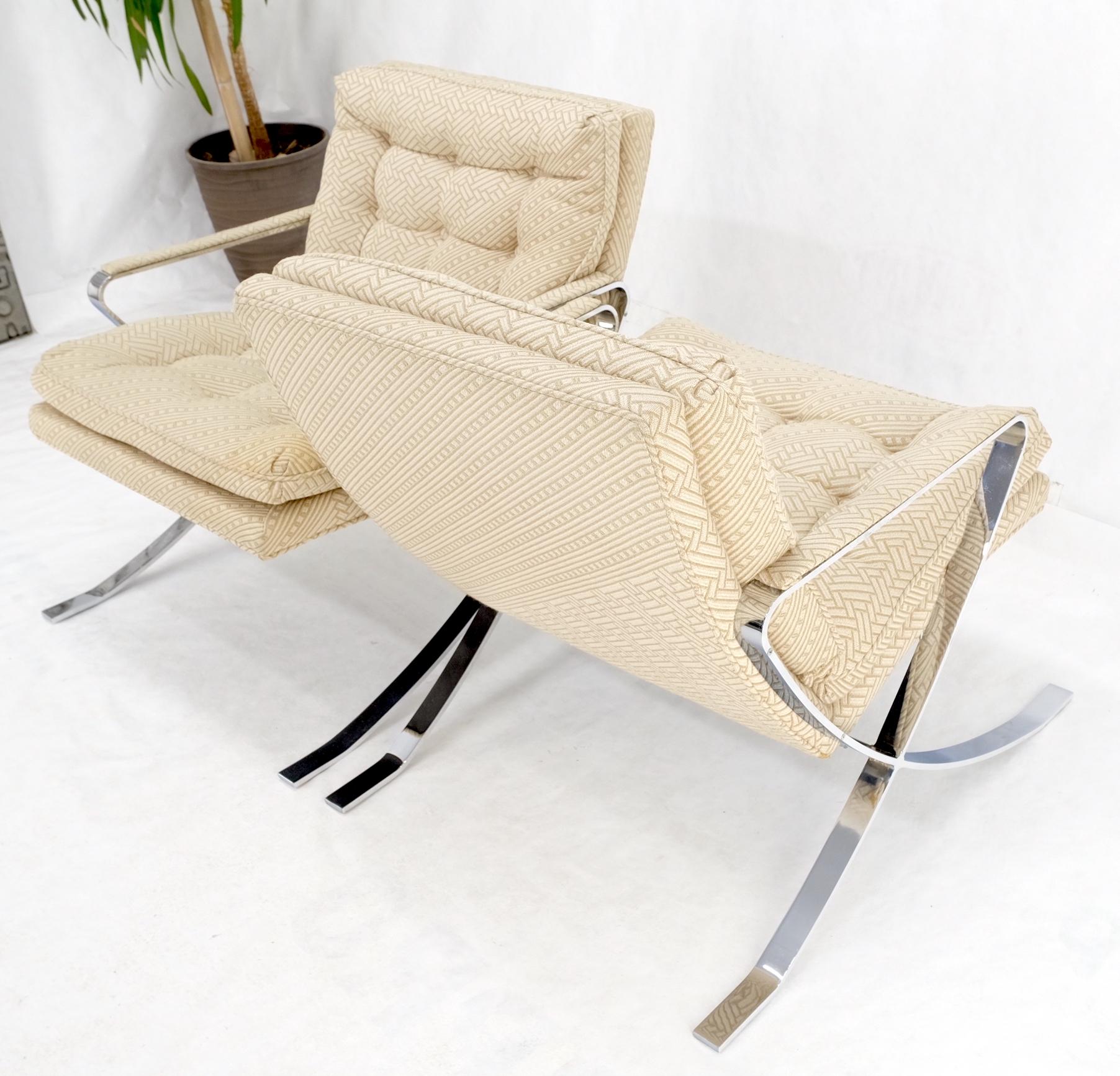 Pair of Mid-Century Modern polished stainless steel Bauhaus arm lounge chairs.
Oatmeal tone texture upholstery fabric.