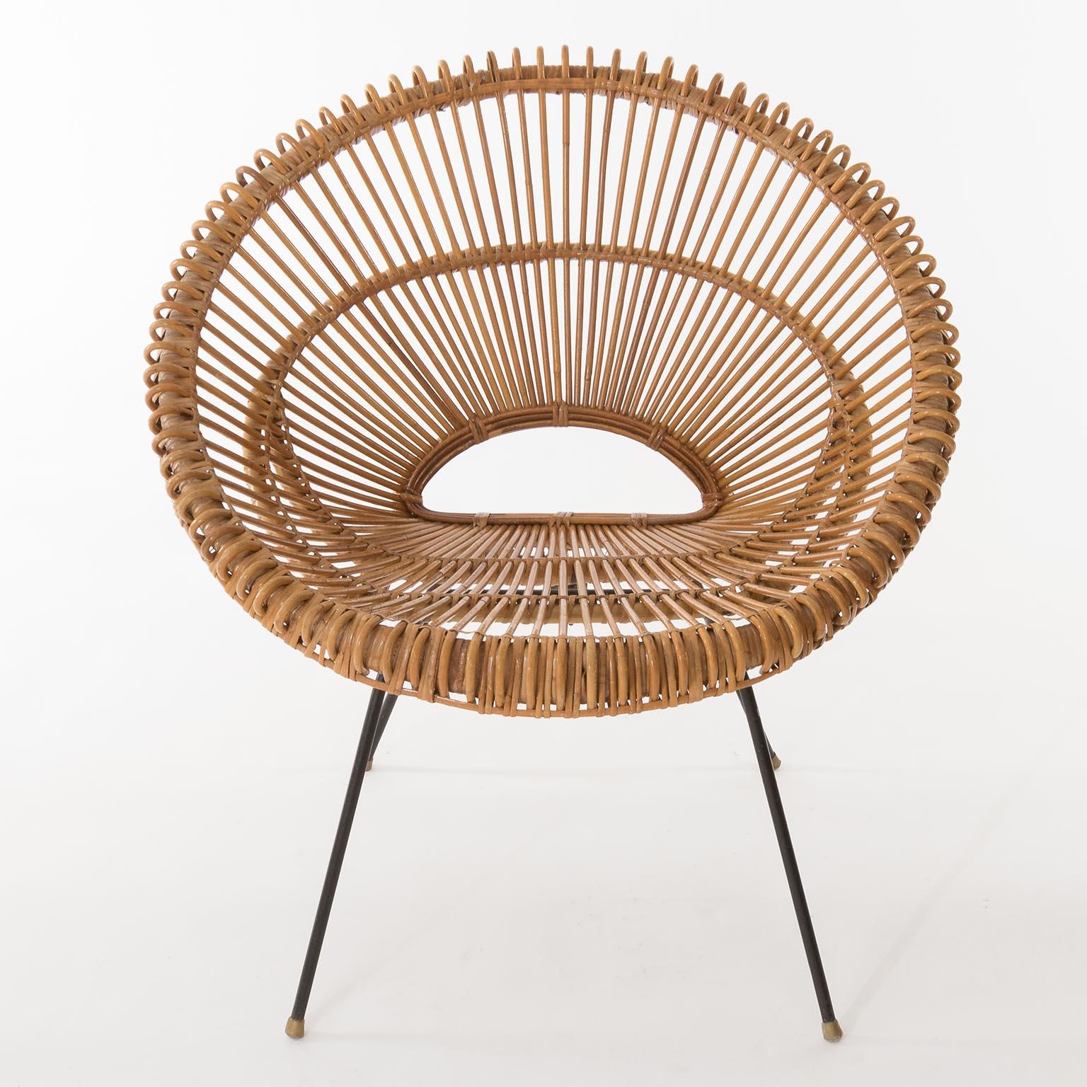 A pair of Riviera chairs made of bamboo, rattan and black metal attributed to Janine Abraham, Dirk Rol, France, circa 1960.