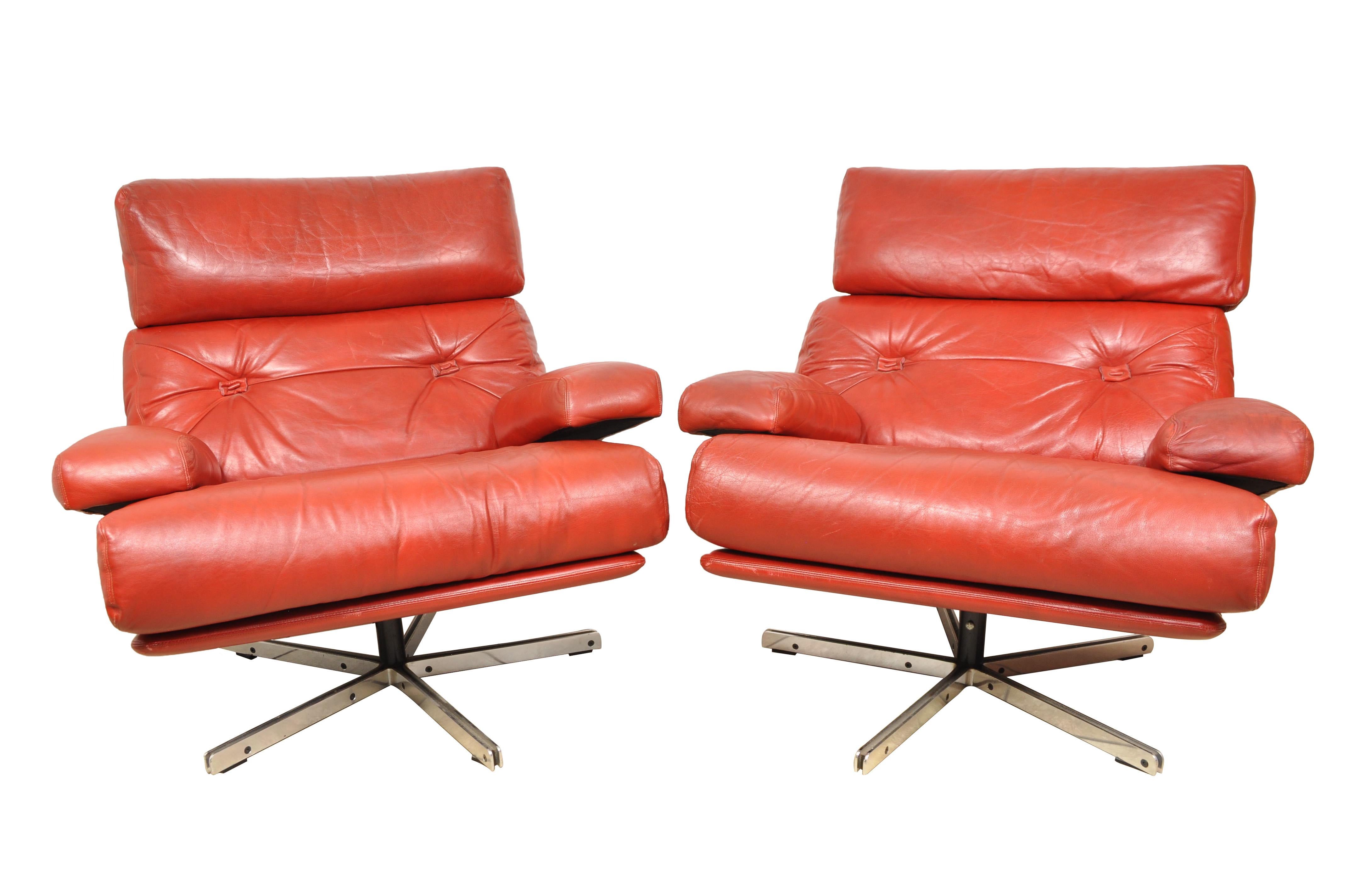 Pair of Italian Mid-Century Modern retro chairs red leather and chrome. Highest quality. These are large swivel lounge chairs upholstered in the original high quality red leather.