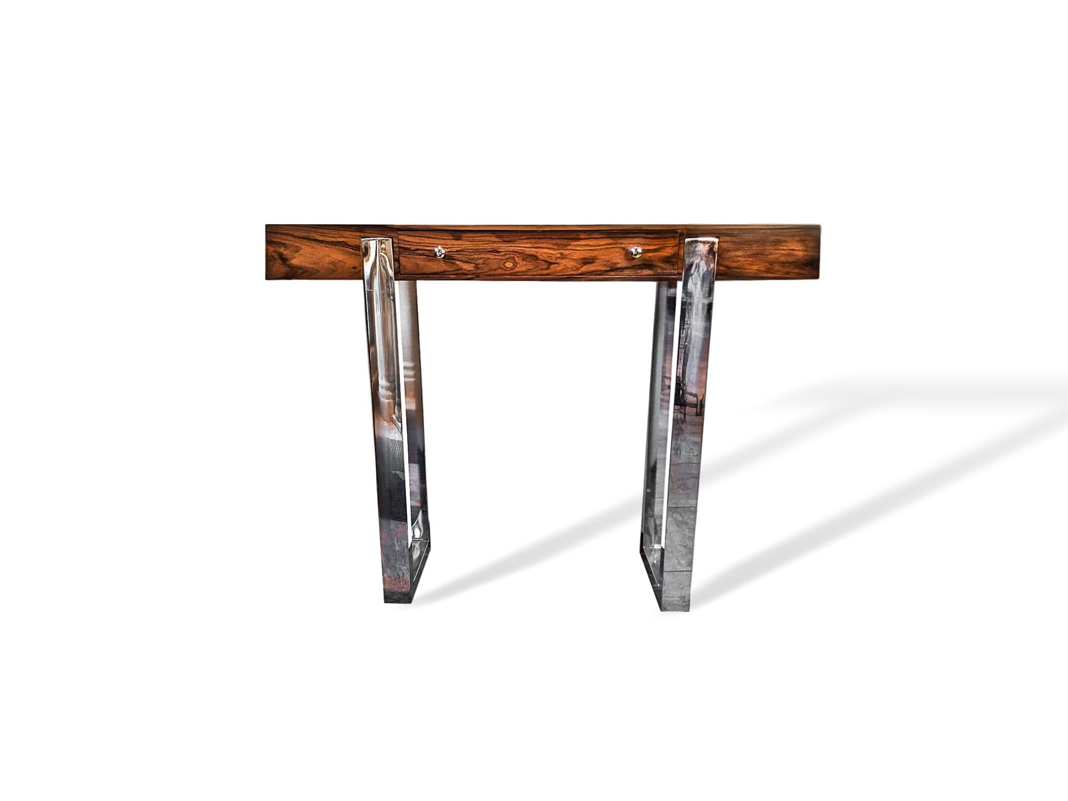 Pair of Mid-Century Modern rosewood and chrome console tables, Italian, circa 1965, each with a single freeze drawer. Highly desirable size and beautifully finished on all sides, so the pieces can float in the room. A rare and beautiful pair of the