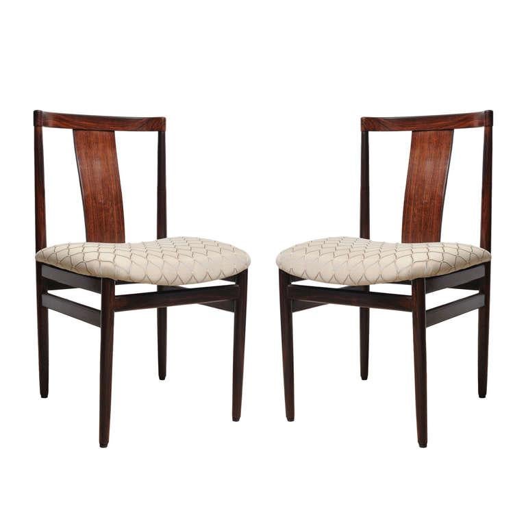 Pair of Mid Century Modern solid rosewood side or office chairs with an easily removed upholstered seat if you wanted to change out the fabric.  Circa 1950.