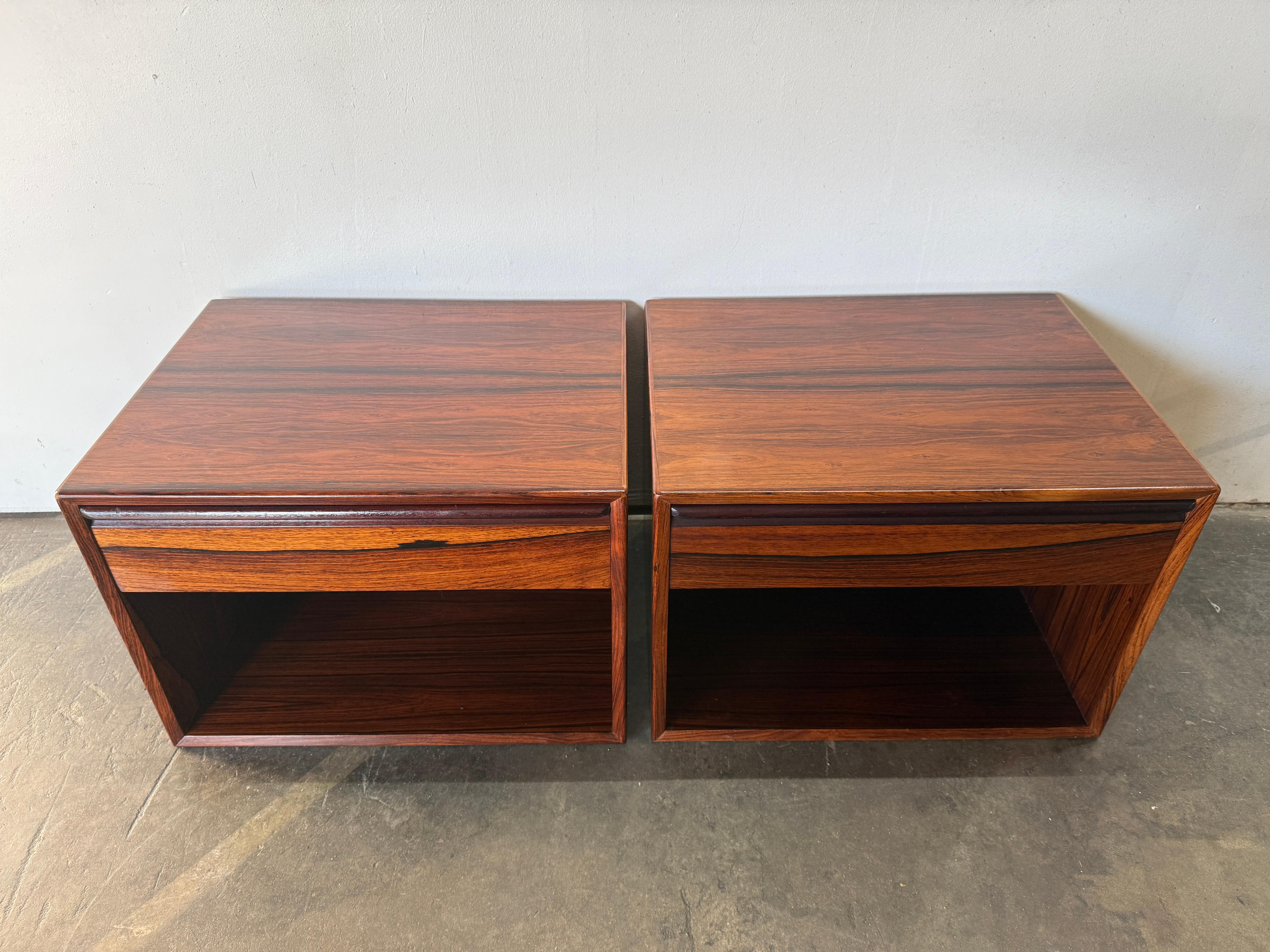 Beautiful Pair of Mid Century Modern Rosewood single drawer wall mounted floating nightstands by Westnofa Made In Norway. Very simple design with inset handles. Very stunning Rosewood wood grain. They are meant to be wall mounted floating. Drawers